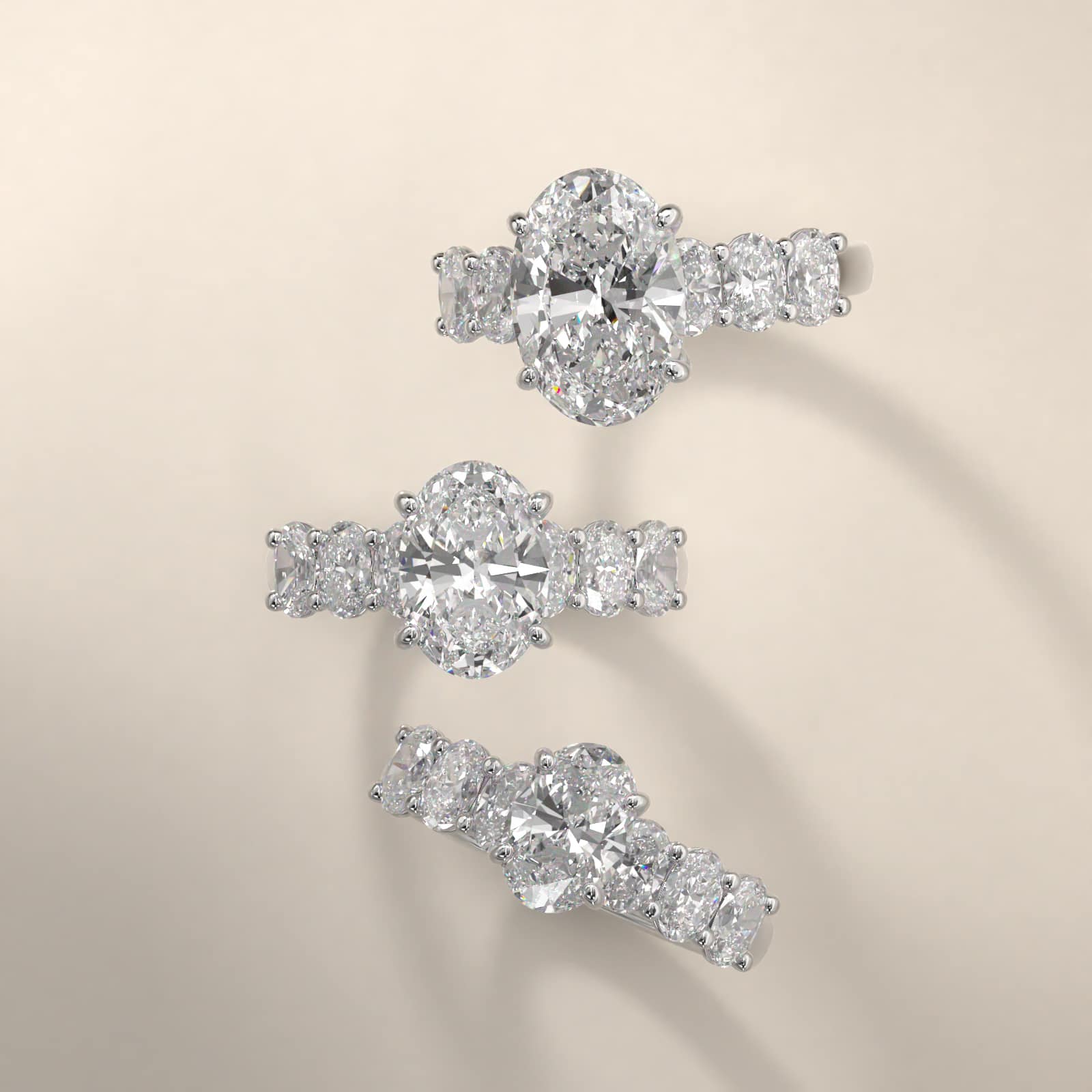 Oval Cut Side Stone Diamond Engagement Ring In 18K White Gold