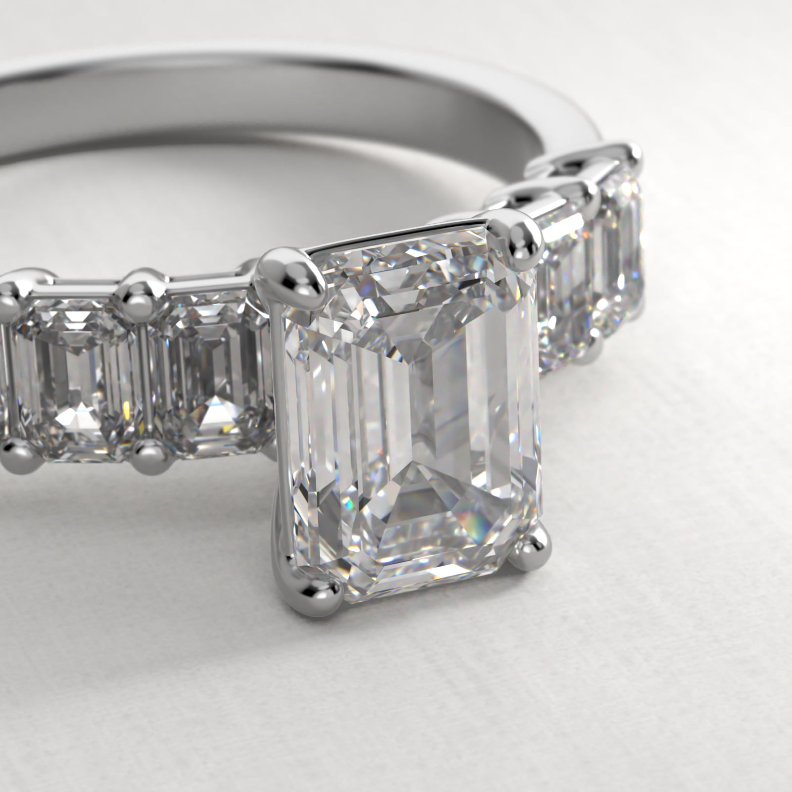 Emerald Cut Side Stone Diamond Engagement Ring In Platinum