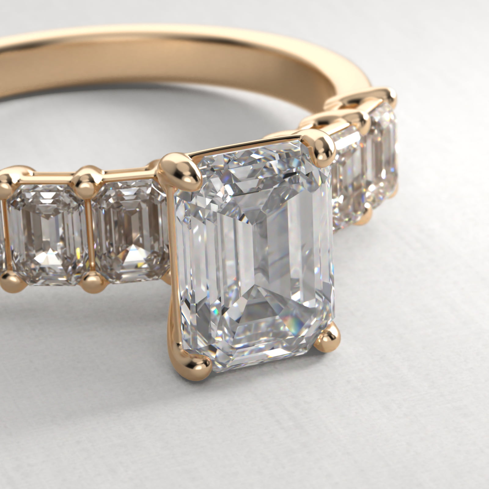 Emerald Cut Side Stone Diamond Engagement Ring In 14K Yellow Gold