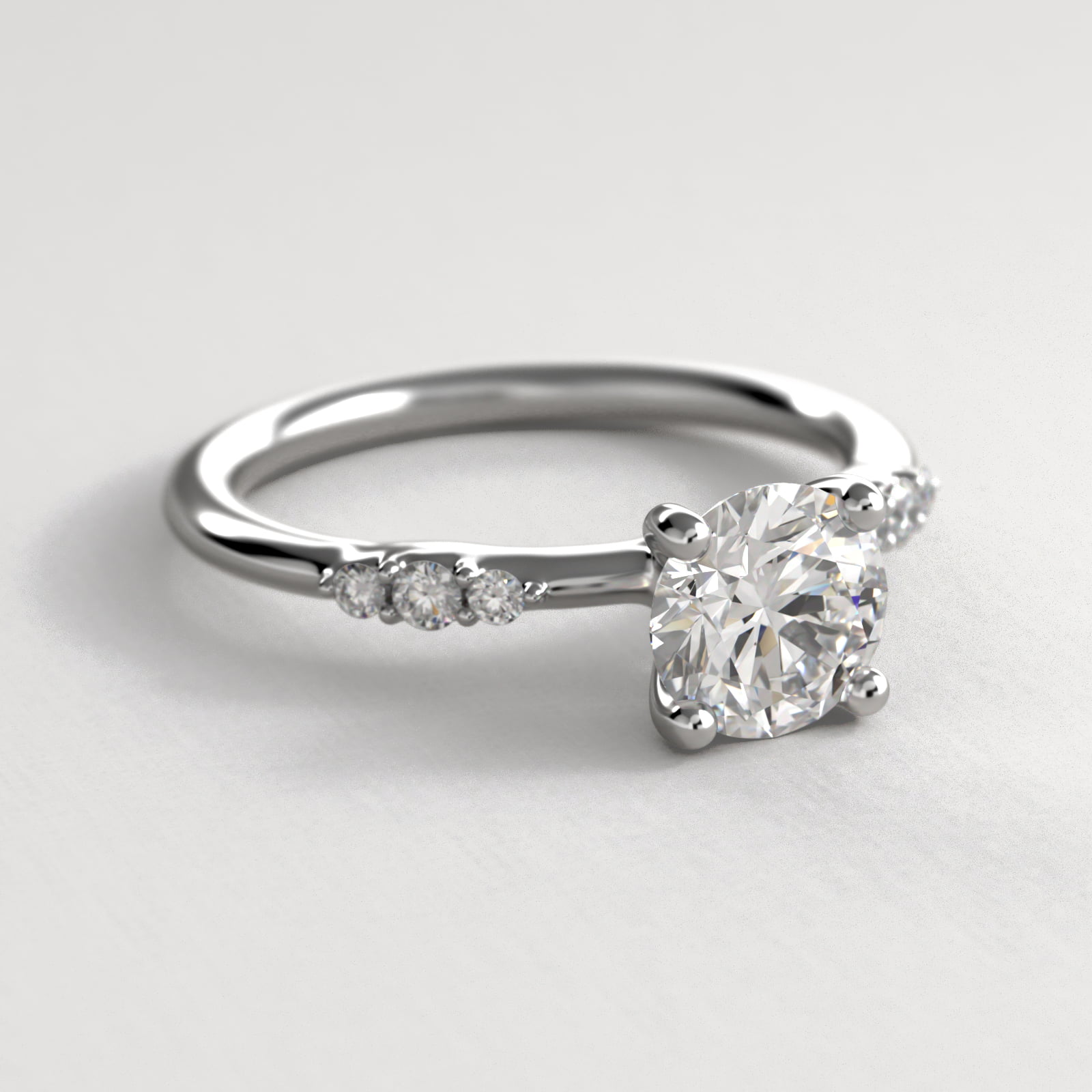 Petite Three Round Diamond Accents Side Stone Engagement Ring In Platinum