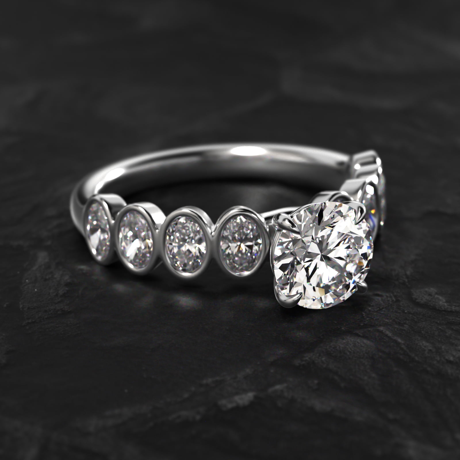 Bezel Set Oval Cut Side Stone Diamond Engagement Ring In 14K White Gold