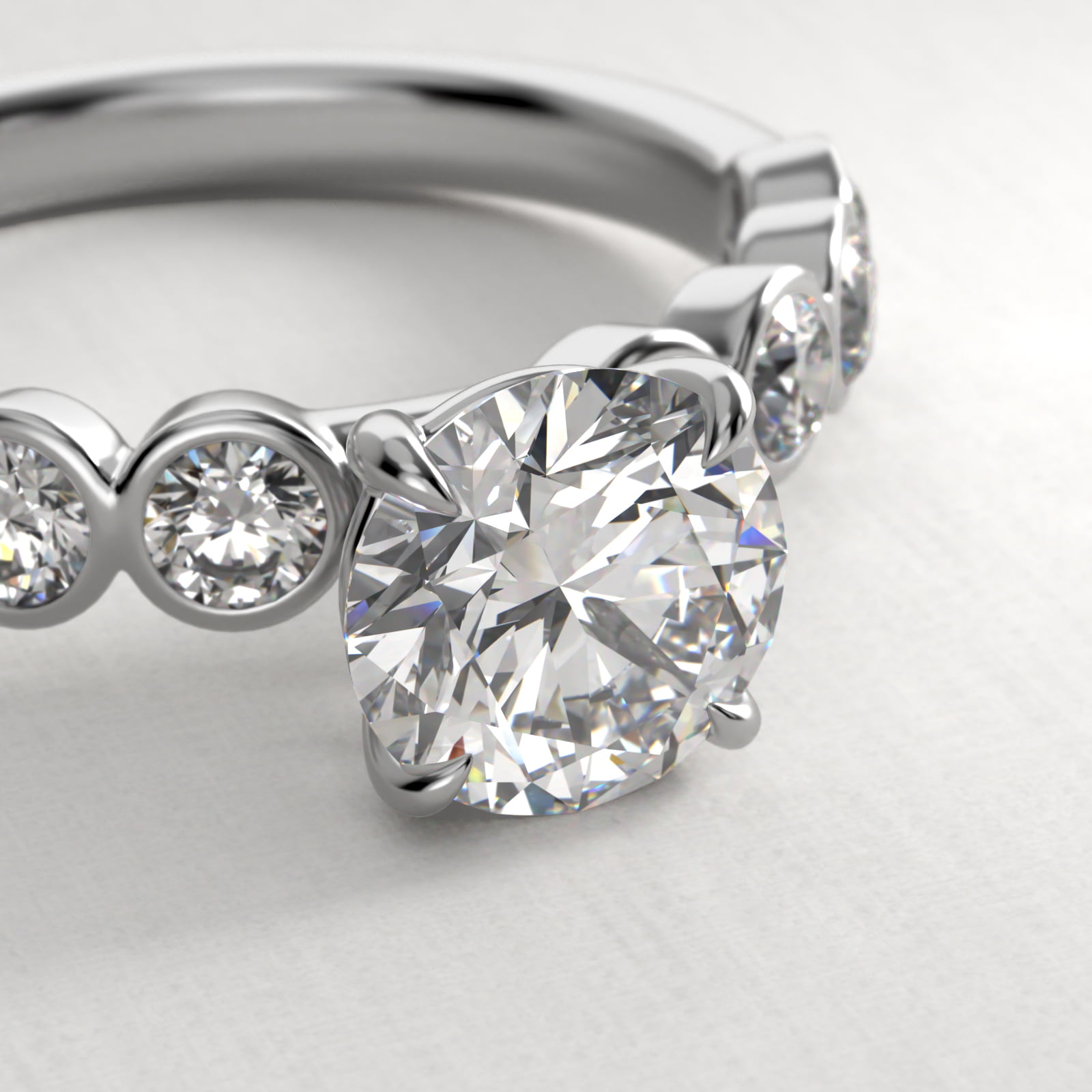 Bezel Set Round Side Stone Diamond Engagement Ring In 18K White Gold