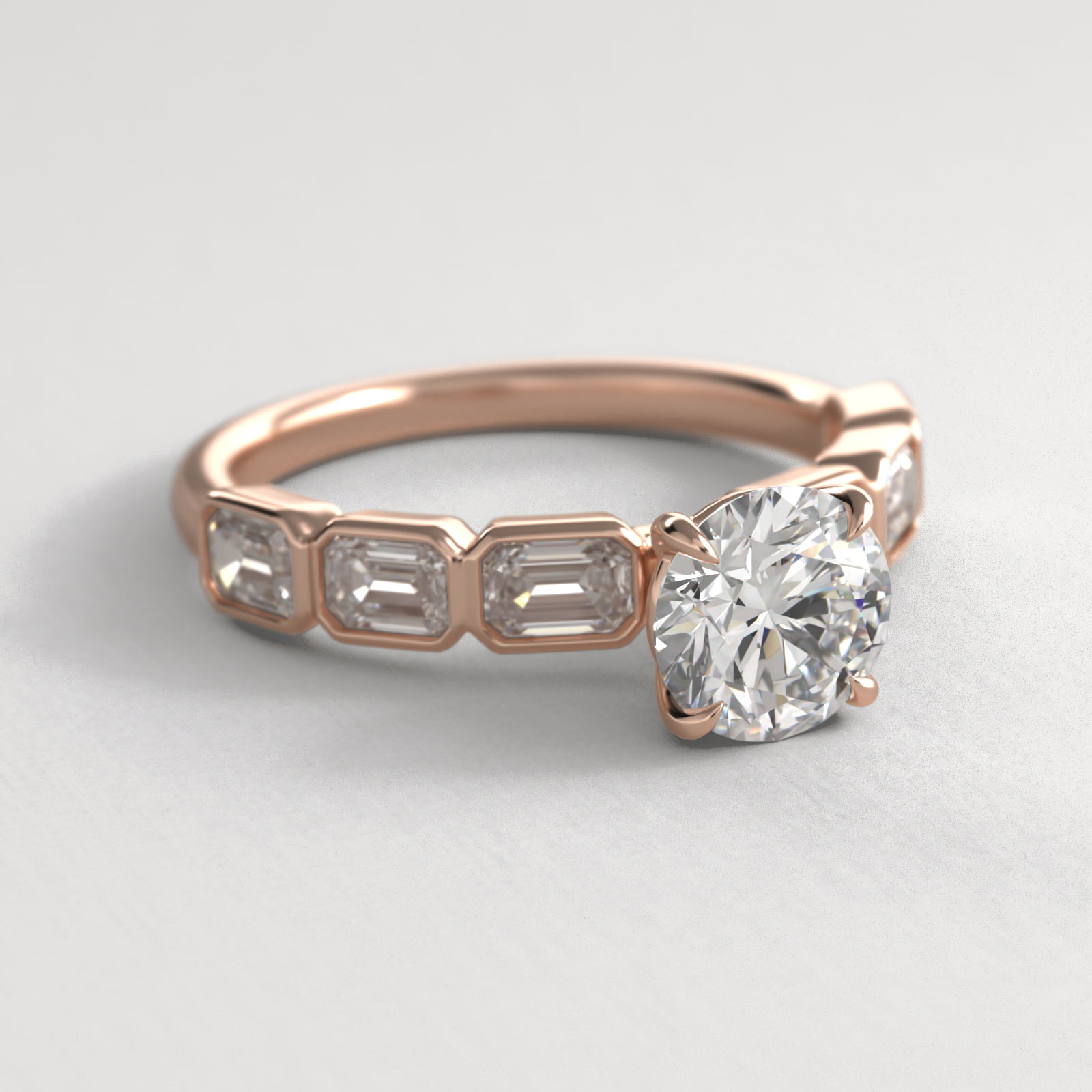 Bezel Set Emerald Cut Side Stone Diamond Engagement Ring In 14K Rose Gold