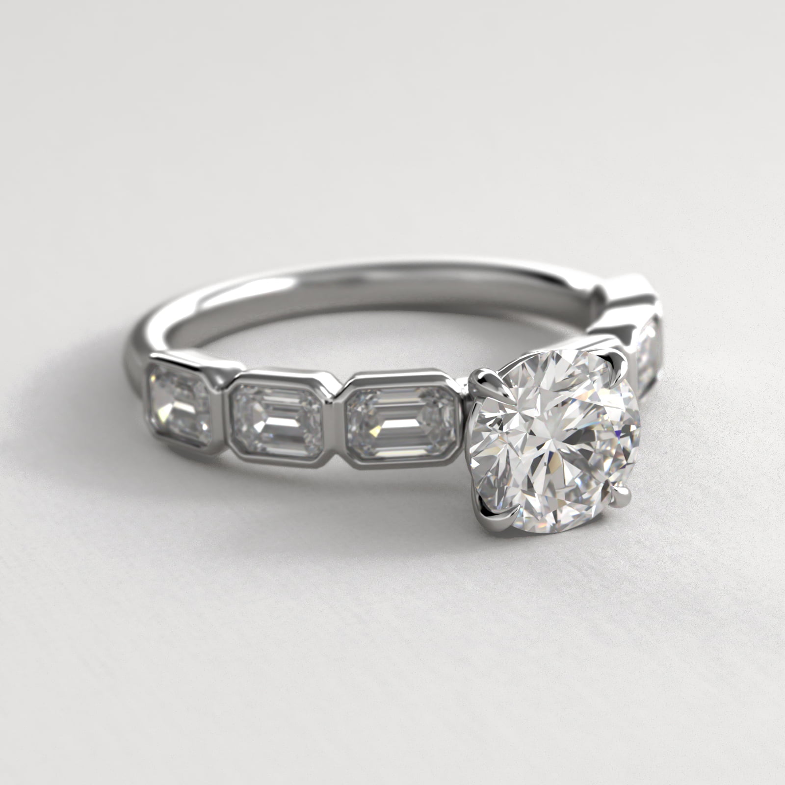 Bezel Set Emerald Cut Side Stone Diamond Engagement Ring In 18K White Gold