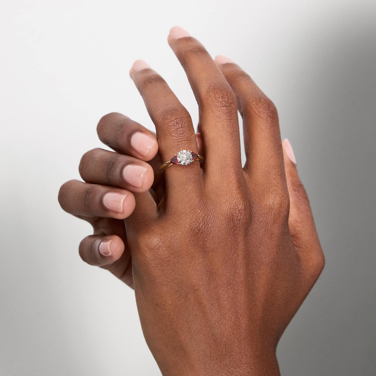 Trillion Cut Ruby Three Stone Engagement Ring In 14K Rose Gold