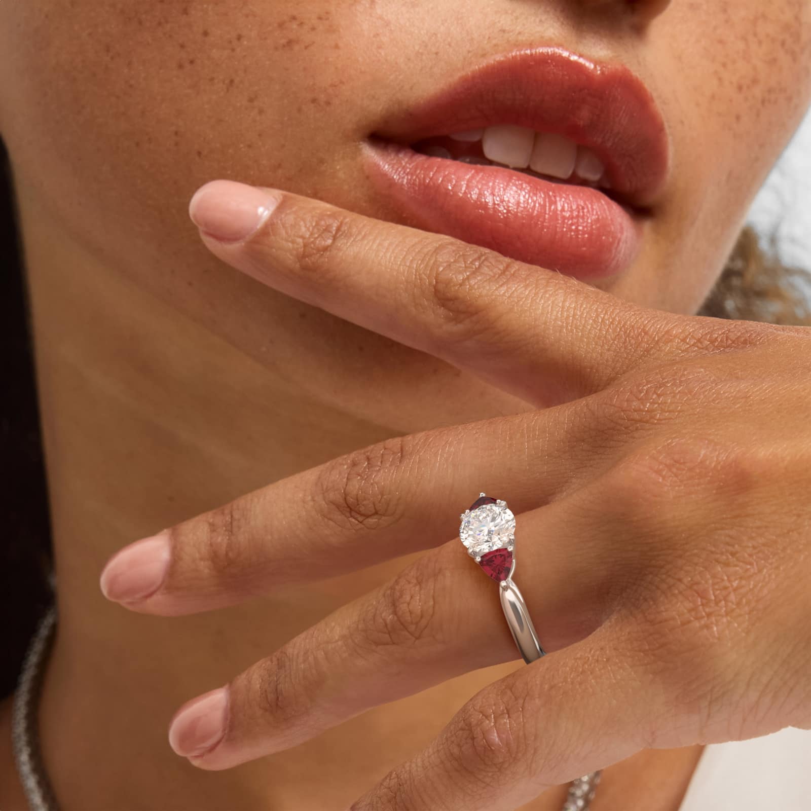 Trillion Cut Ruby Three Stone Engagement Ring In Platinum