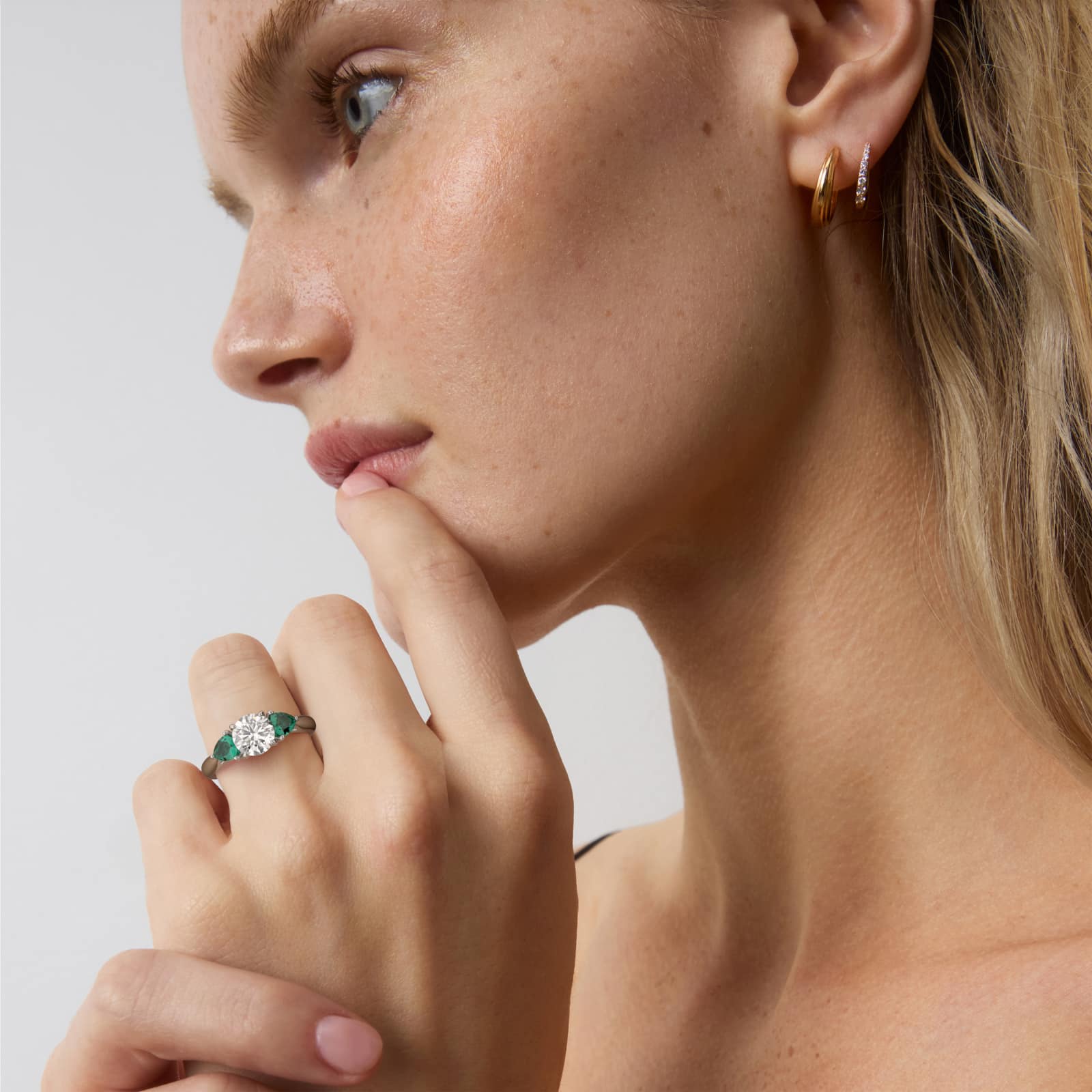 Pear Shaped Emerald Three Stone Engagement Ring In Platinum