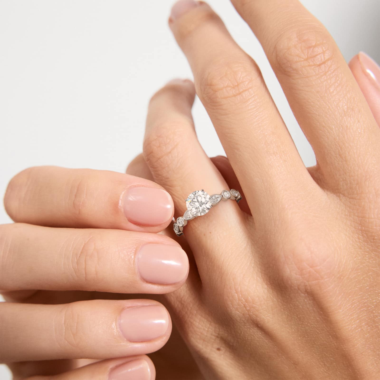 Round and Marquise Cut Side Stone Diamond Engagement Ring In 18K White Gold