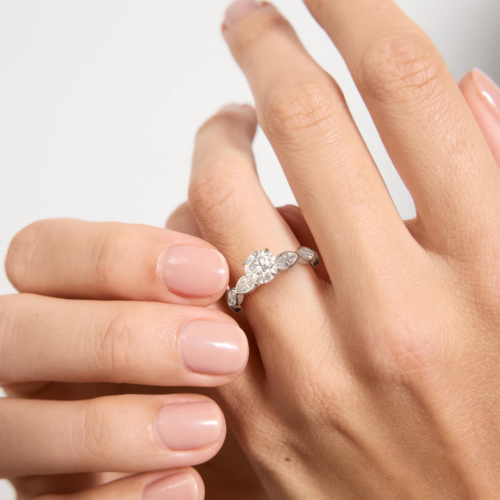 Bezel Set Marquise Cut Side Stone Diamond Engagement Ring In 18K White Gold