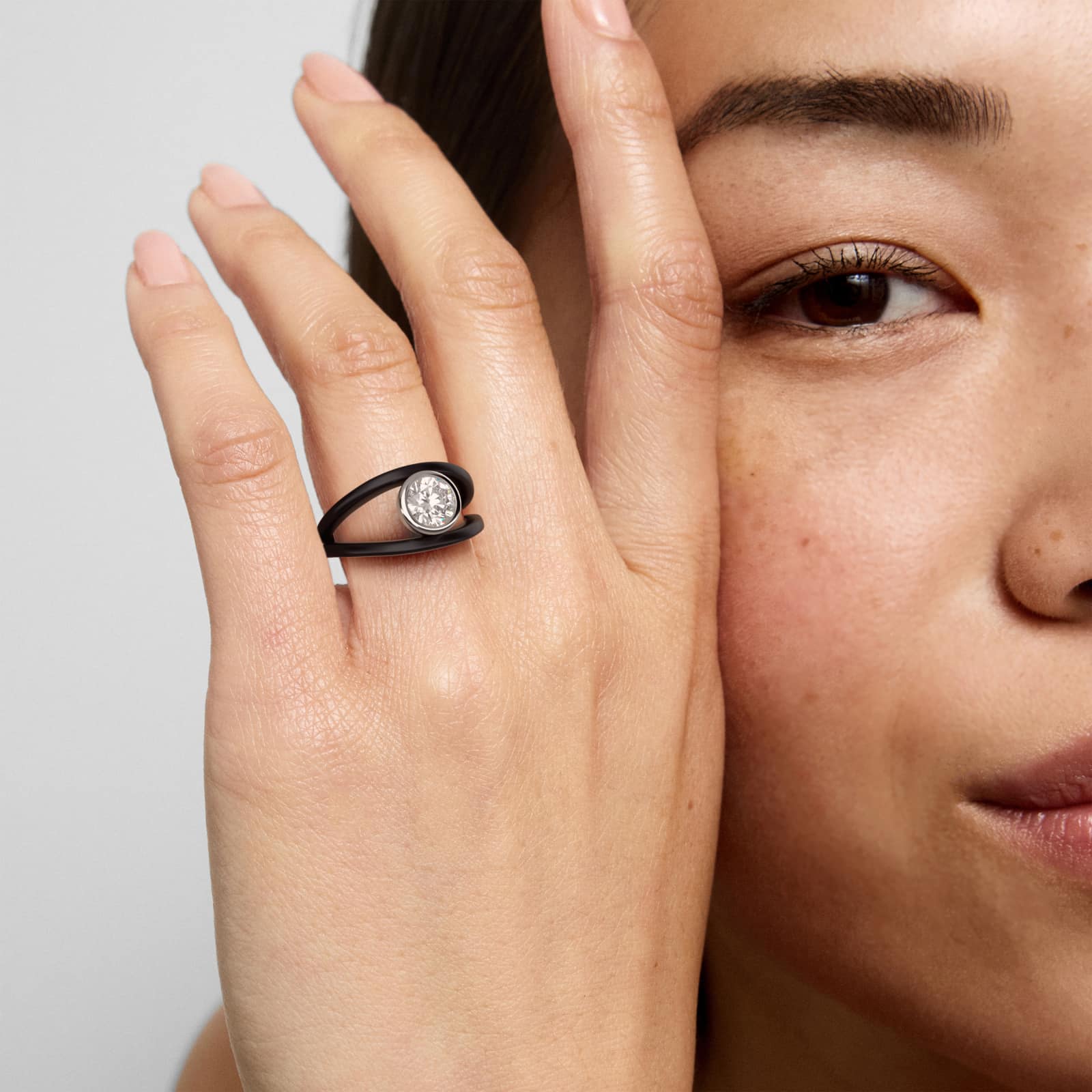 Bezel Set Open Space Noir Solitaire Engagement Ring In 18K Black And White Gold