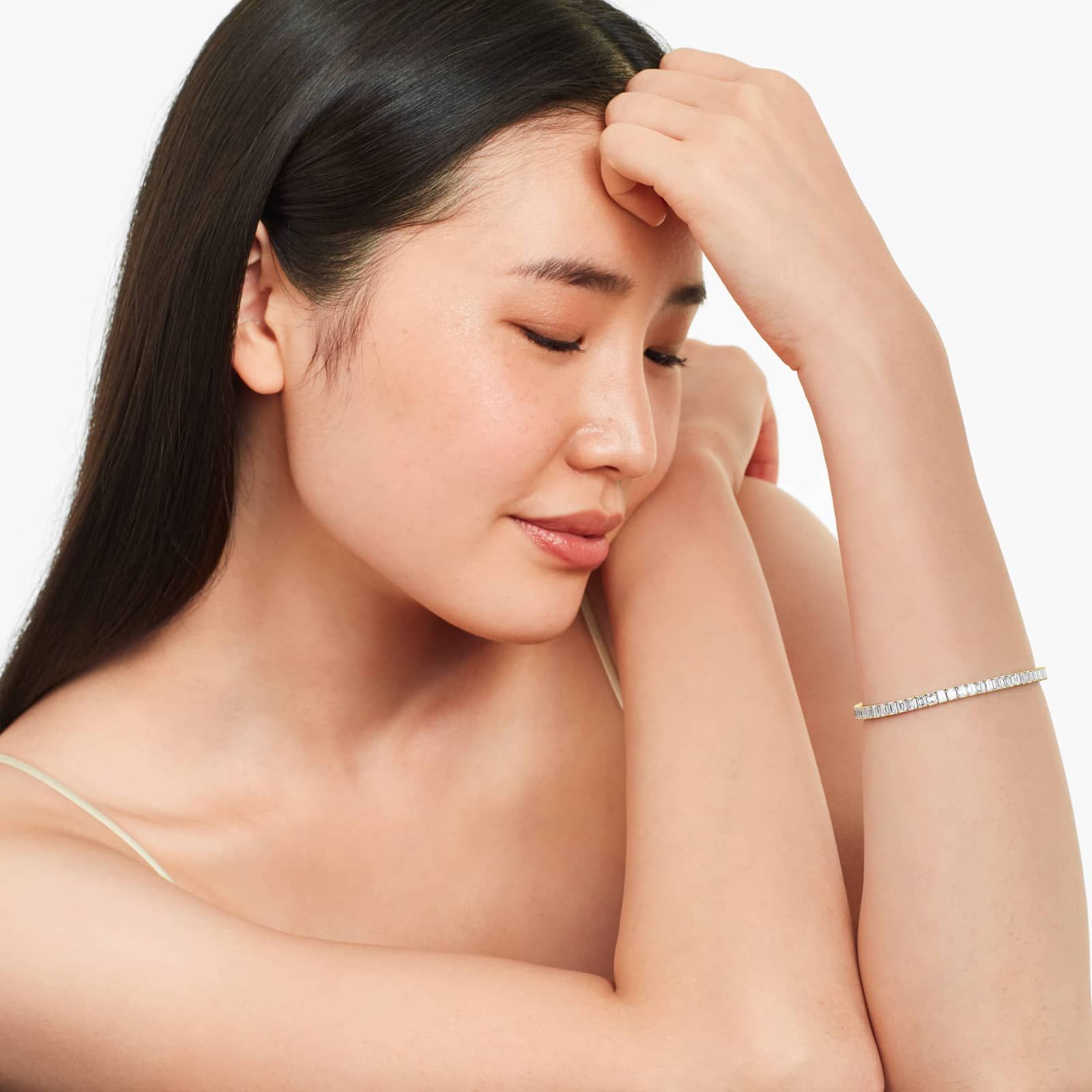 Tennis Bracelet With 10 CTW Emerald Cut Diamonds In 14K Yellow Gold (7")