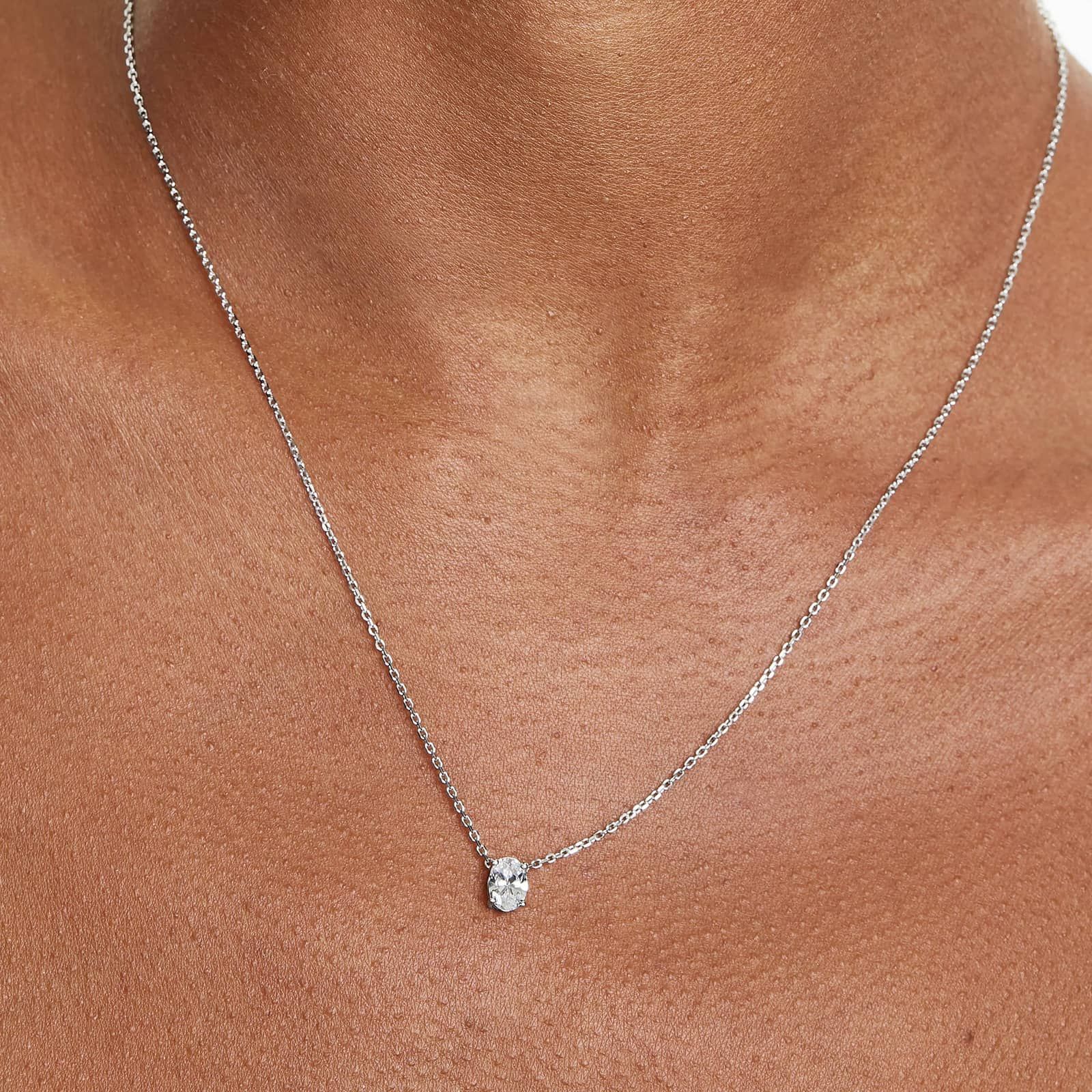 Platinum Oval Shape Diamond Solitaire Pendant (0.75 CTW - H-I / SI1-SI2)