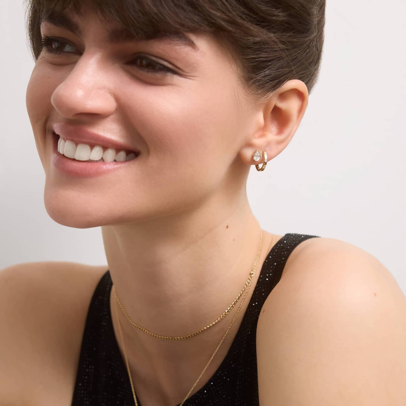 Bezel Diamond Stud Earrings With 0.75 CTW Pear Shaped Diamonds in 14K Yellow Gold