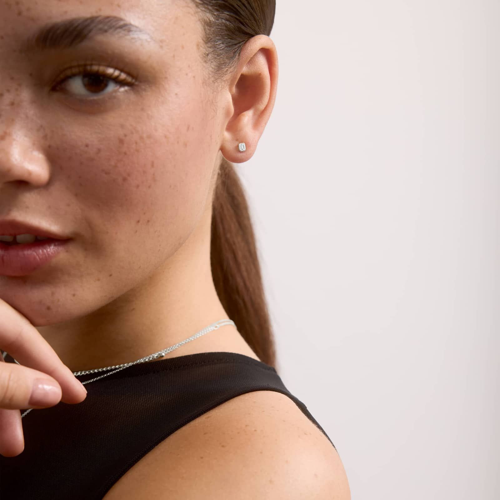 Bezel Diamond Stud Earrings With 0.25 CTW Emerald Cut Diamonds in Platinum