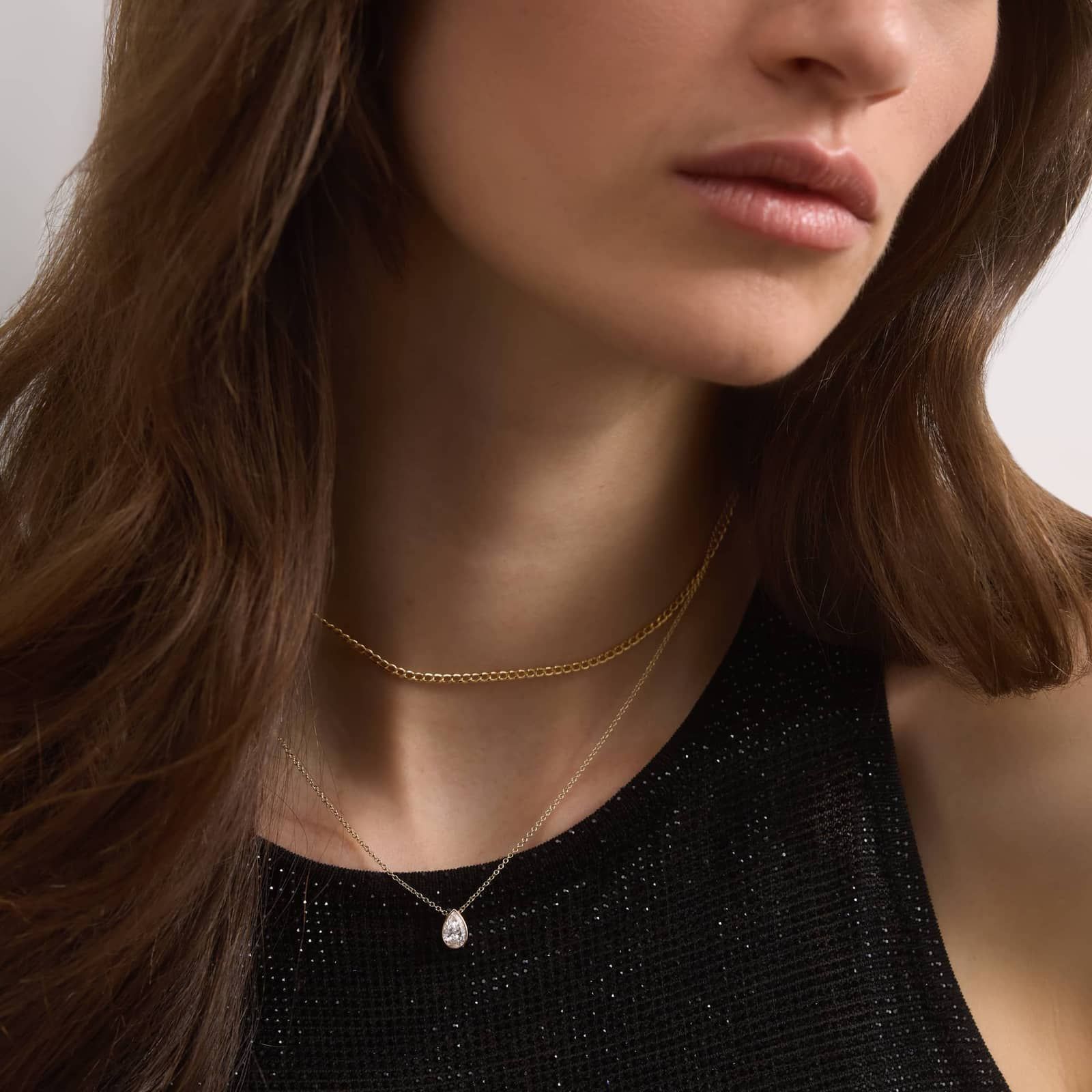 Bezel Solitaire Pendant Necklace With 0.75 CTW Pear Shaped Diamond in 14K Yellow Gold