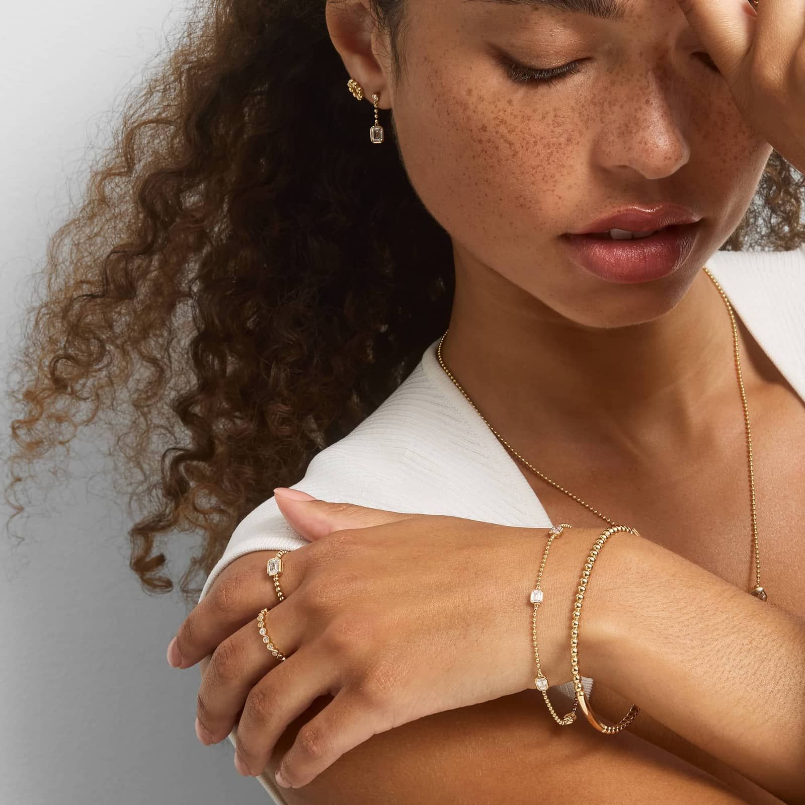 East-West Bezel Beaded Ring With 0.5 CTW Emerald Cut Lab-Grown Diamond in 14K Yellow Gold