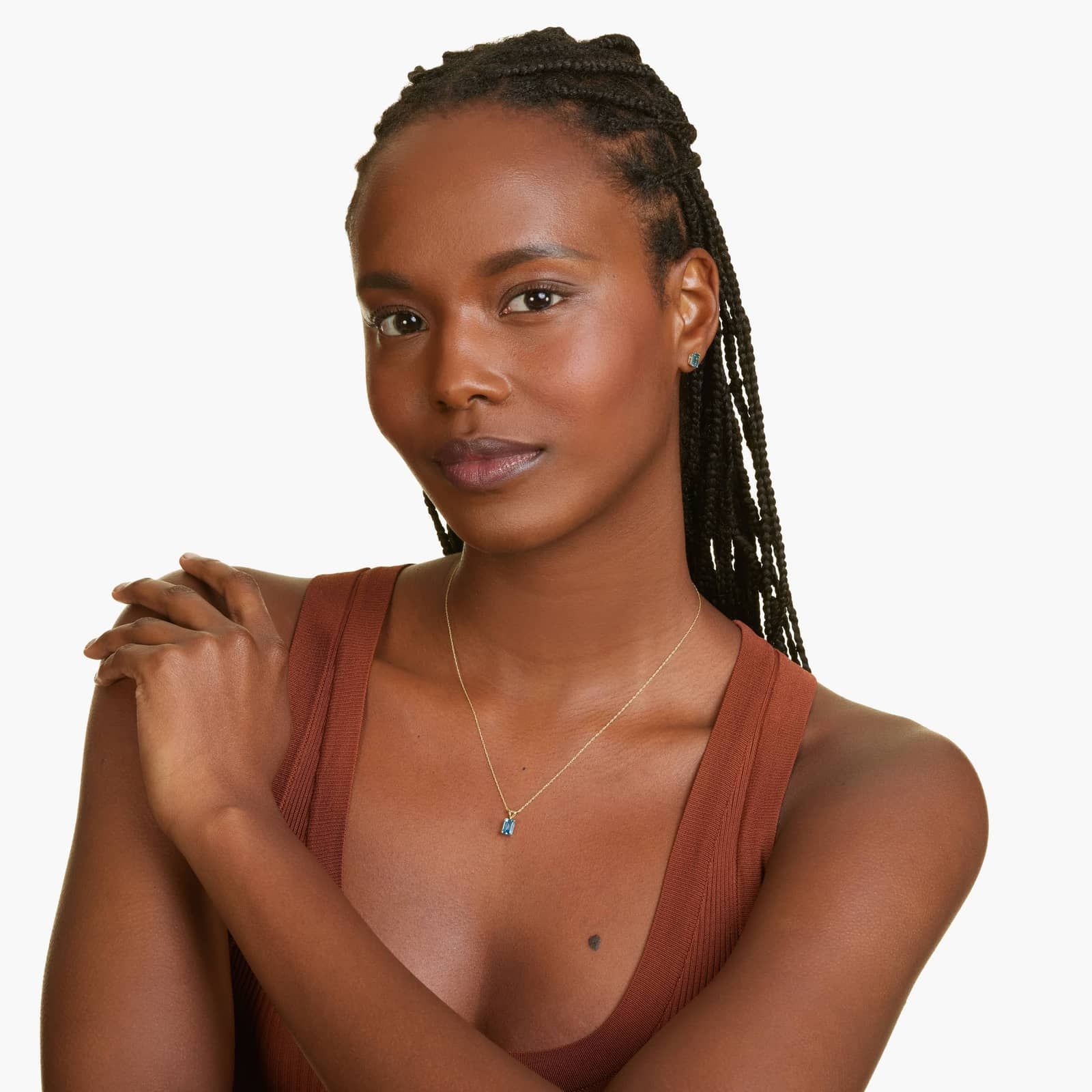 Emerald Cut Swiss Blue Topaz Birthstone Stud Earrings In 14K Yellow Gold