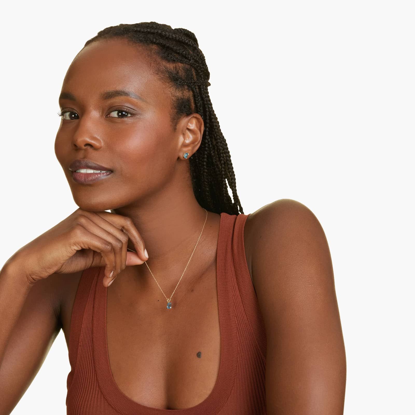 Emerald Cut Swiss Blue Topaz Birthstone Stud Earrings In 14K Yellow Gold