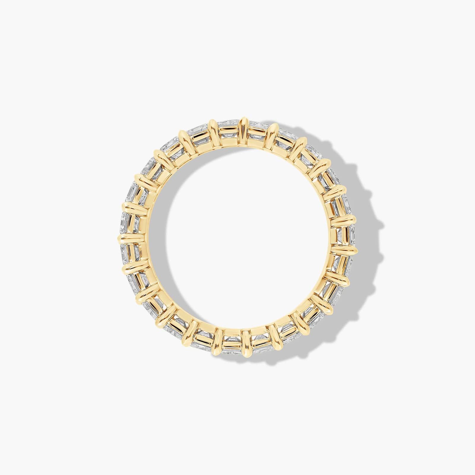 Eternity Ring With 3 CTW Emerald Cut Diamonds In 14K Yellow Gold (4.00mm)