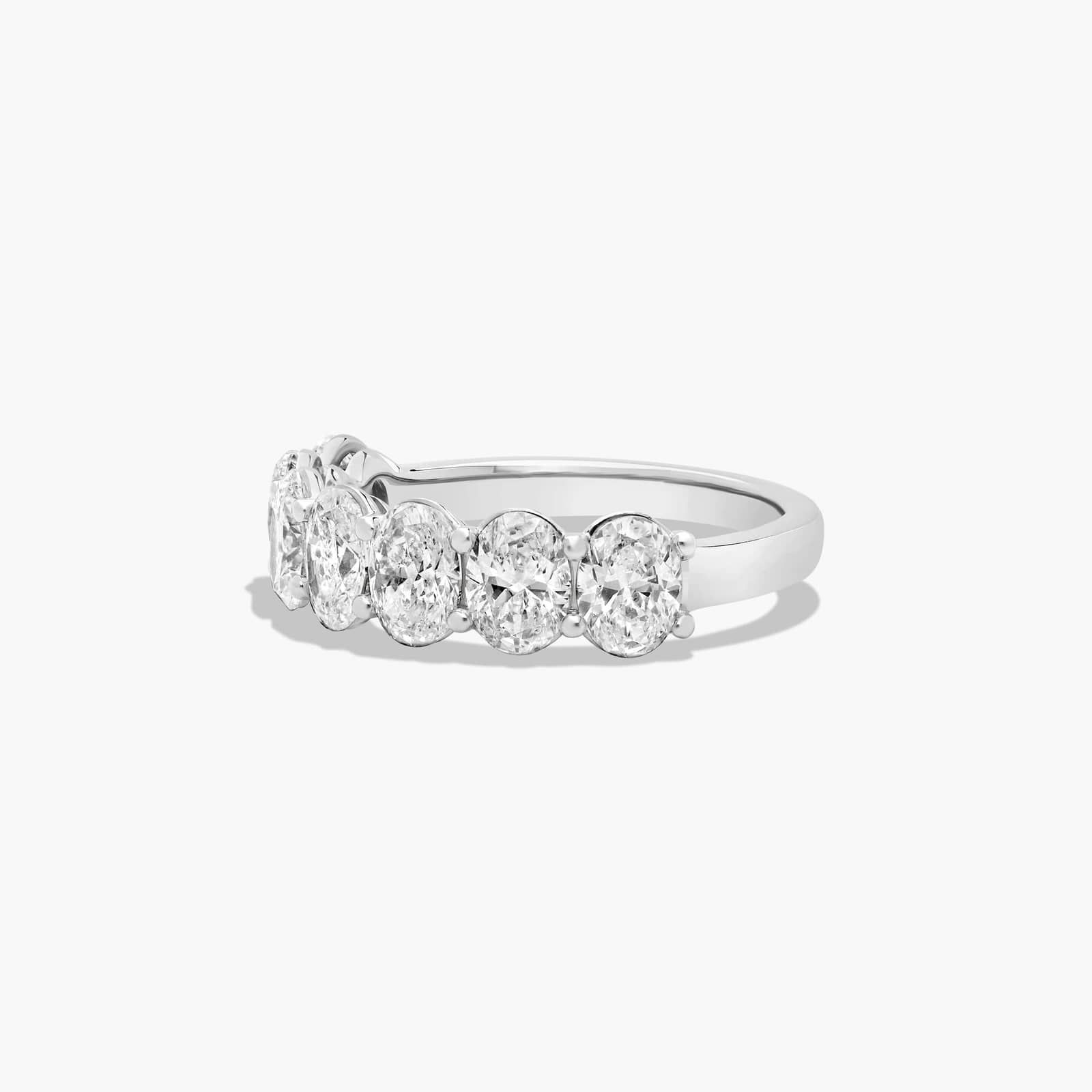 Seven Stone Anniversary Ring With 3 CTW Oval Cut Diamonds In Platinum (2.50mm)