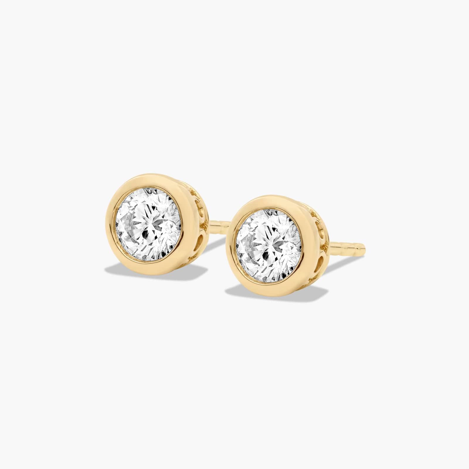 Bezel 0.5 CTW Diamond Stud Earrings In 14K Yellow Gold