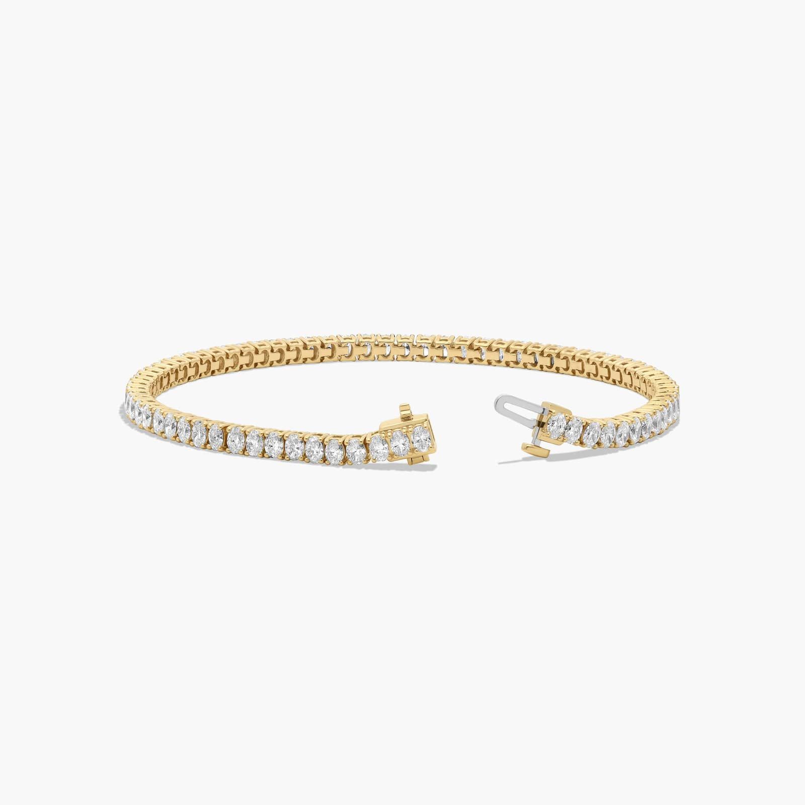 Tennis Bracelet With 5 CTW Oval Cut Lab-Grown Diamonds In 14K Yellow Gold