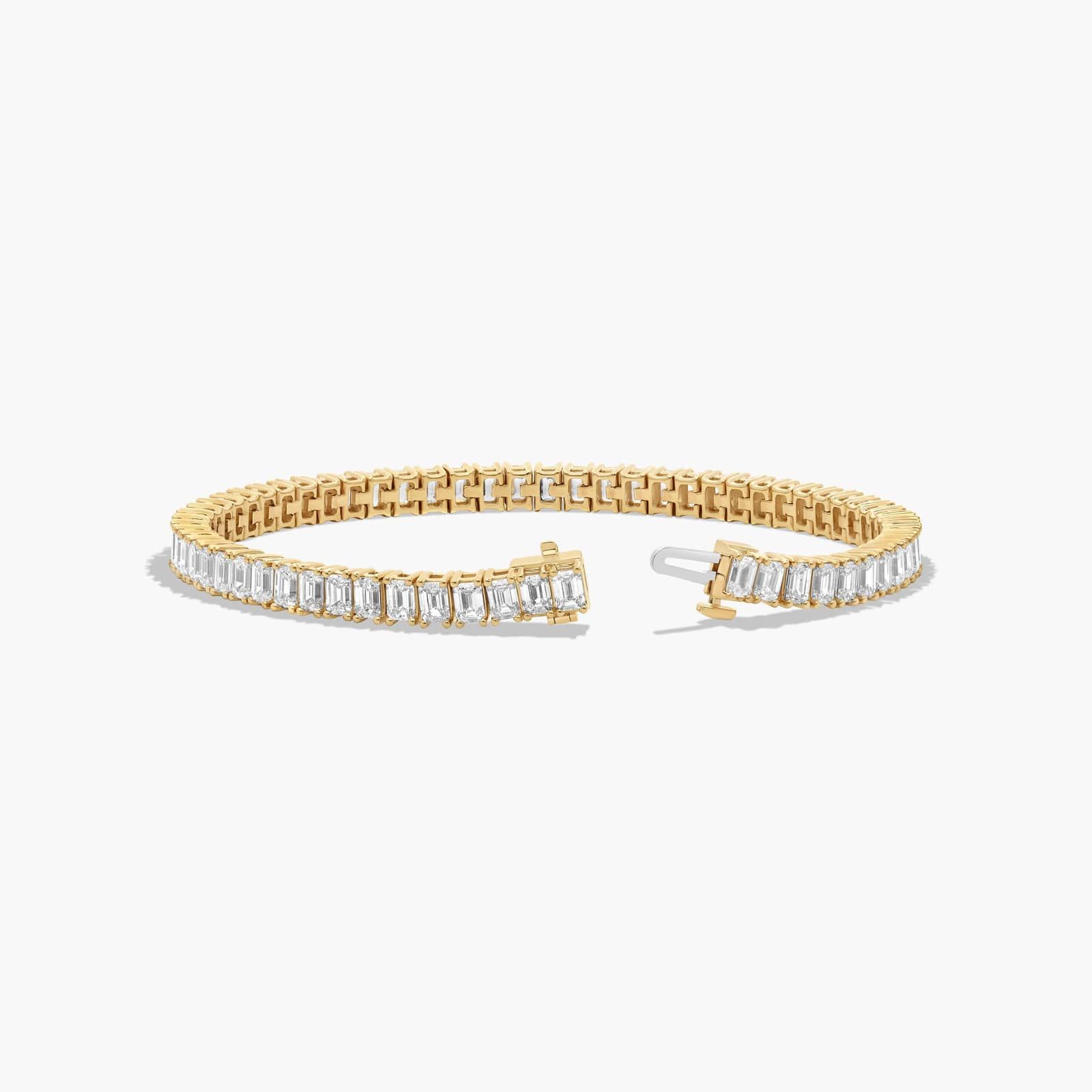 Tennis Bracelet With 10 CTW Emerald Cut Diamonds In 14K Yellow Gold (7")