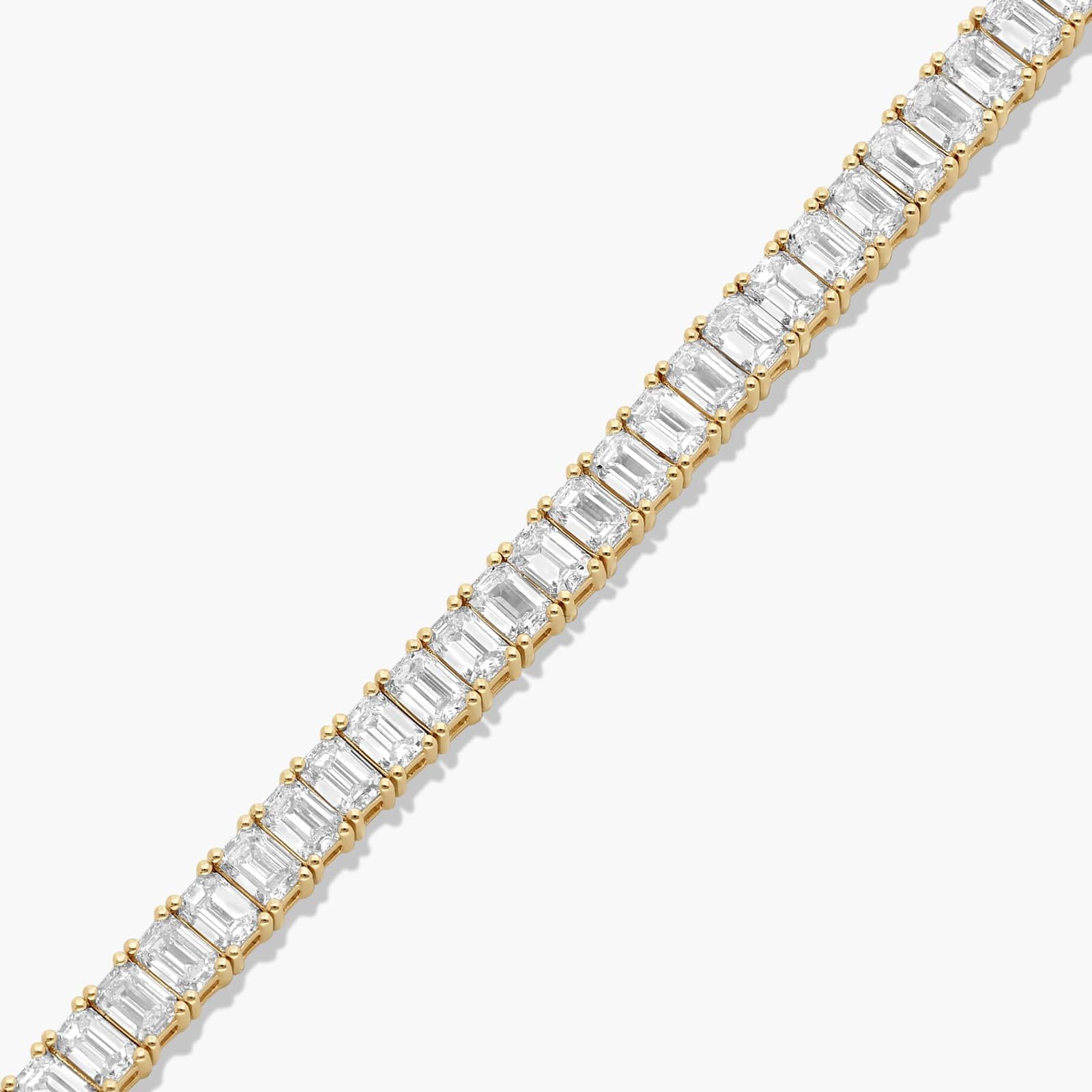 Tennis Bracelet With 10 CTW Emerald Cut Diamonds In 14K Yellow Gold (7")