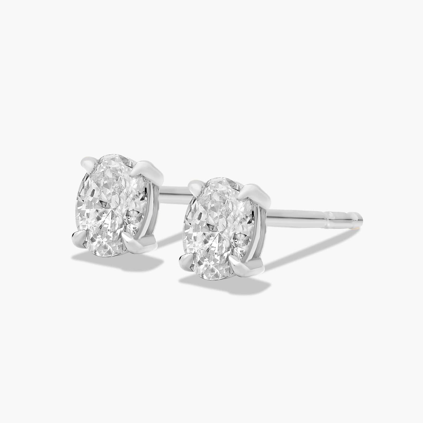 Oval Cut 0.25 CTW Diamond Stud Earrings In Platinum