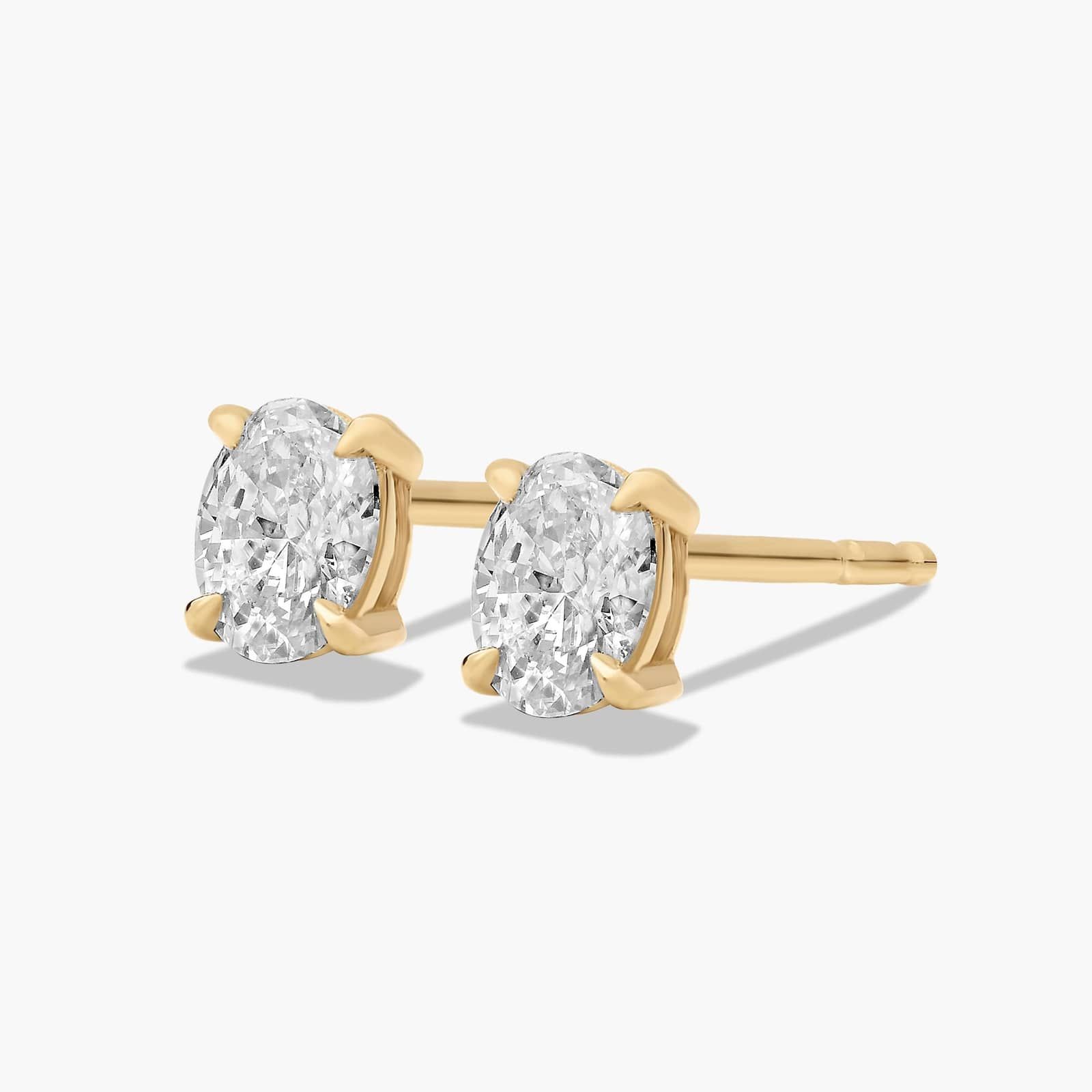 Oval Cut 0.25 CTW Diamond Stud Earrings In 14K Yellow Gold
