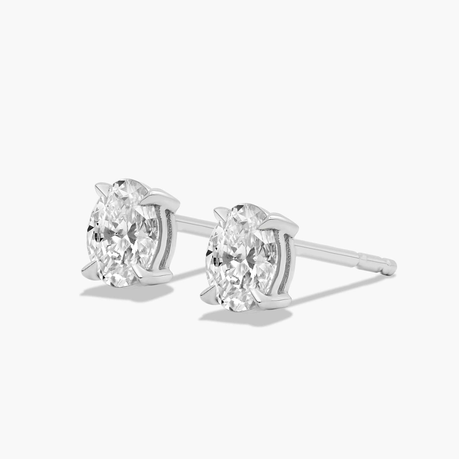 Oval Cut 0.5 CTW Diamond Stud Earrings In 14K White Gold