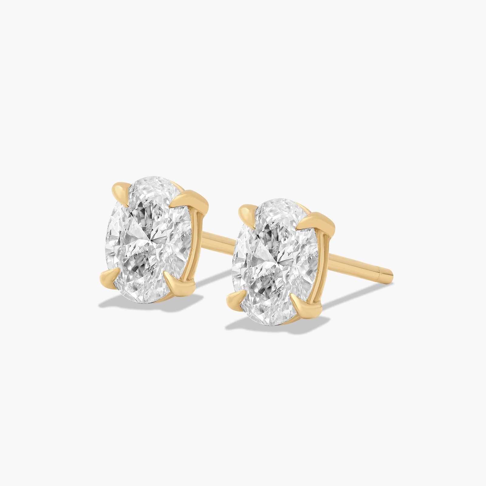 Oval Cut 0.75 CTW Diamond Stud Earrings In 14K Yellow Gold