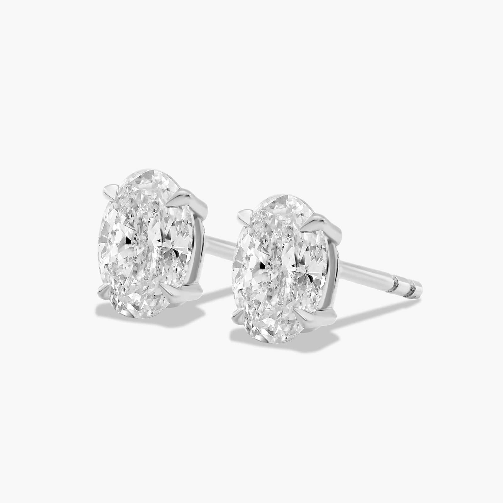 Oval Cut 1 CTW Diamond Stud Earrings In 14K White Gold