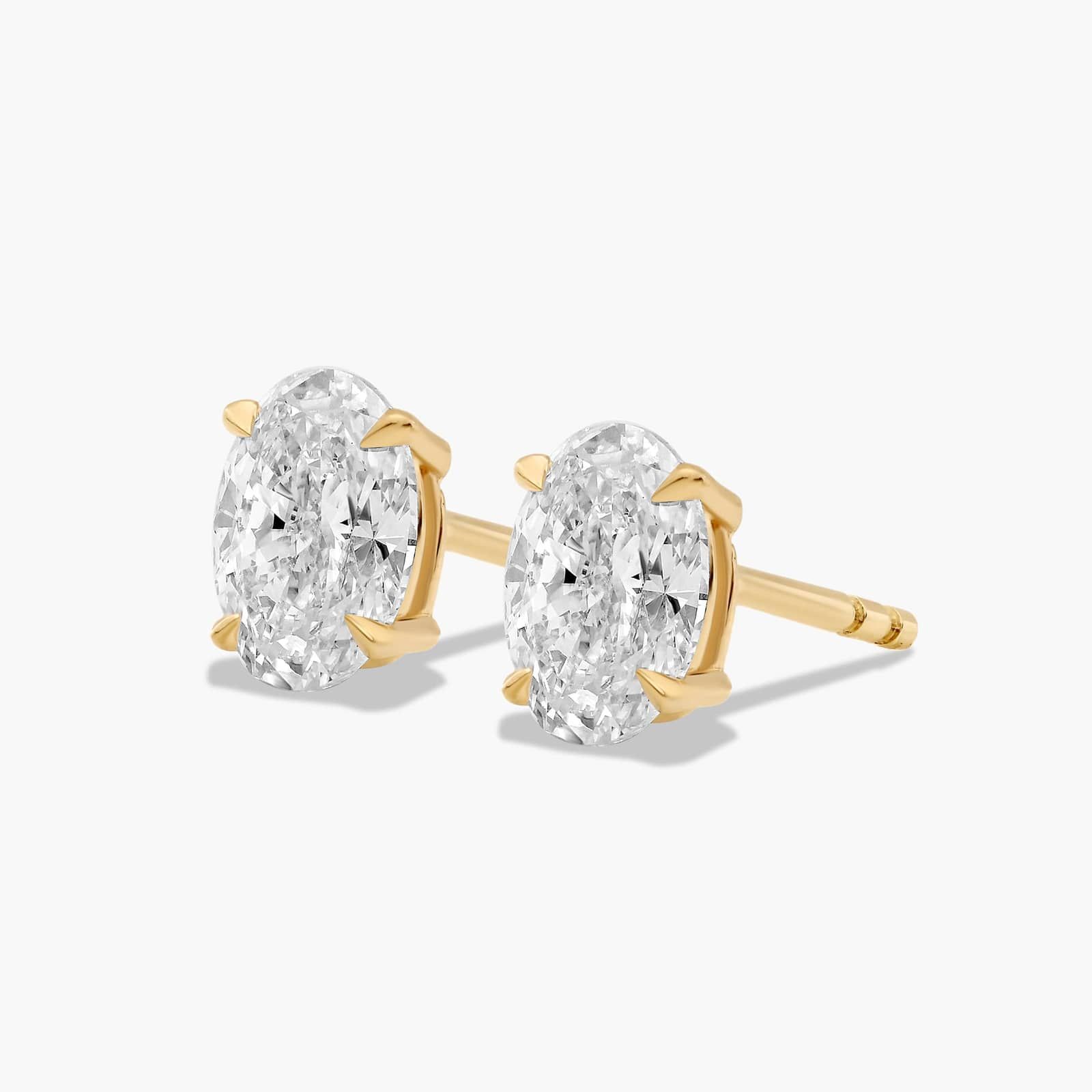 Oval Cut 1 CTW Diamond Stud Earrings In 14K Yellow Gold
