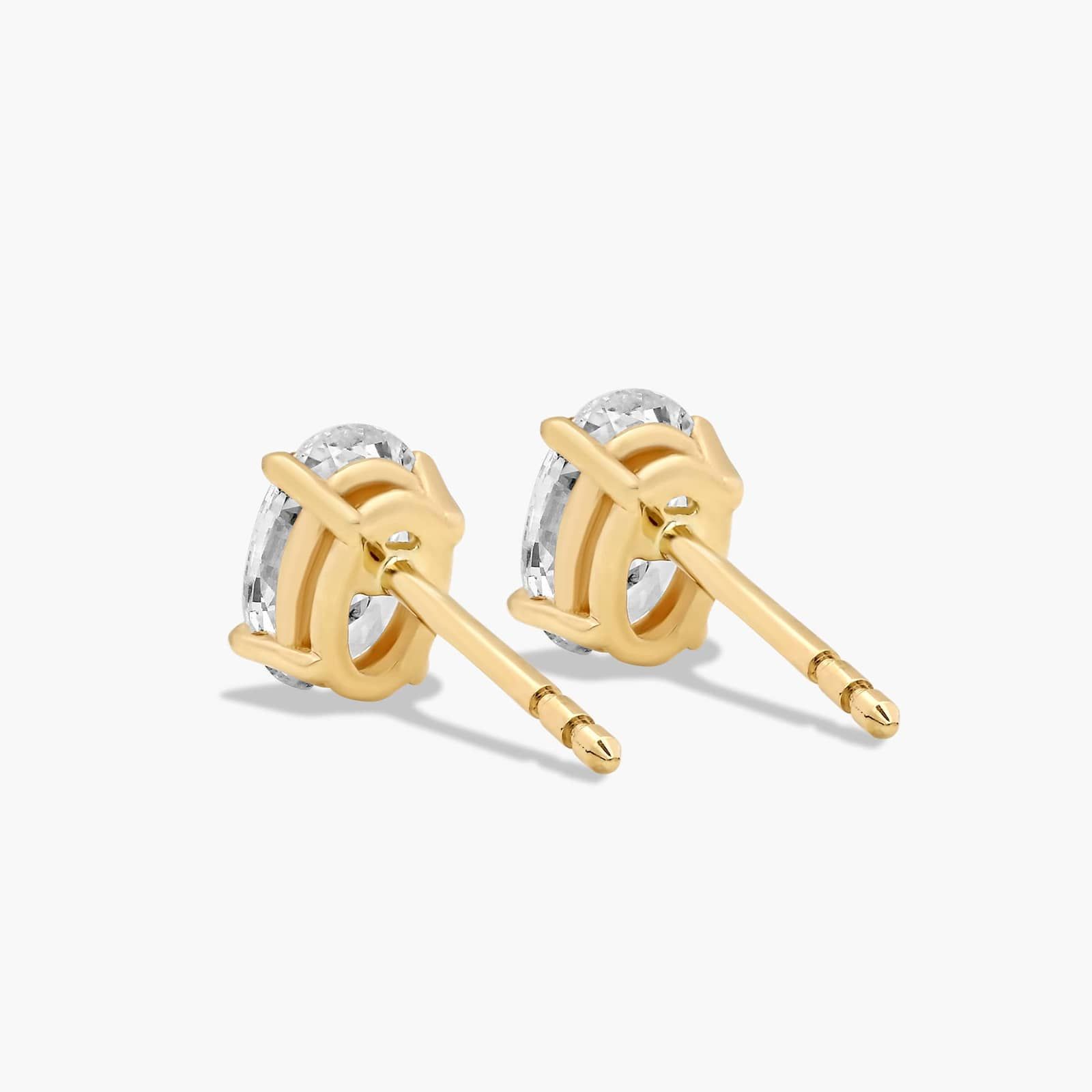 Oval Cut 1 CTW Diamond Stud Earrings In 14K Yellow Gold