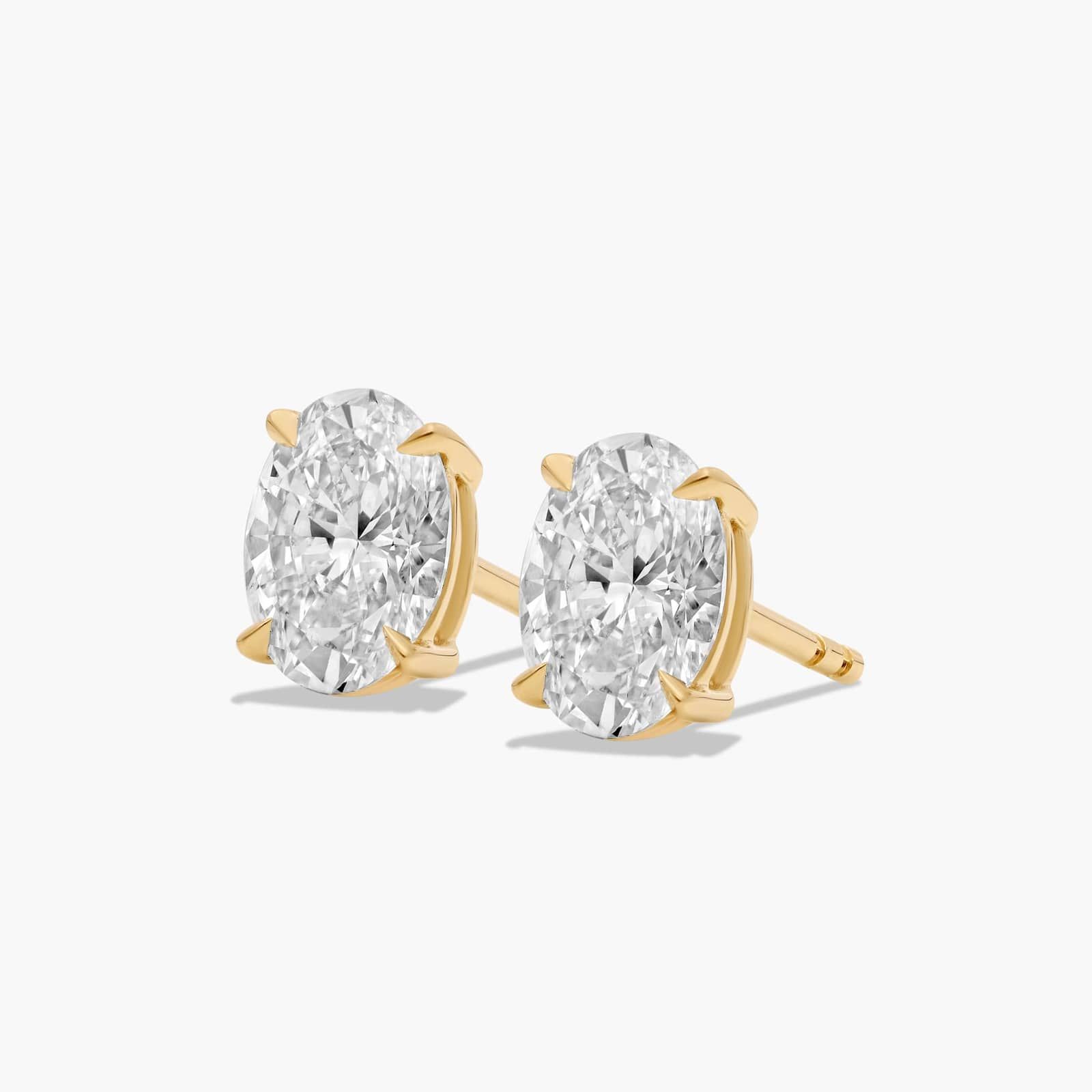 Oval Cut 1.5 CTW Lab-Grown Diamond Stud Earrings In 14K Yellow Gold
