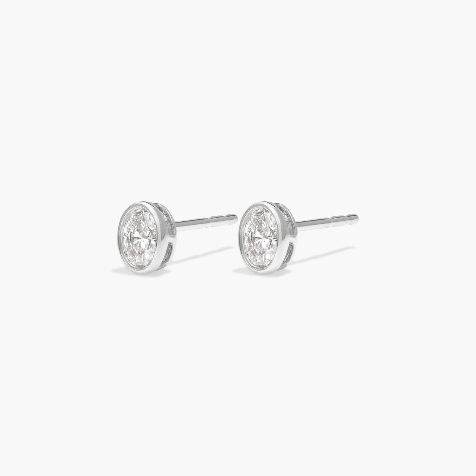 Bezel Stud Earrings With 0.25 CTW Oval Cut Lab-Grown Diamonds in 14K White Gold