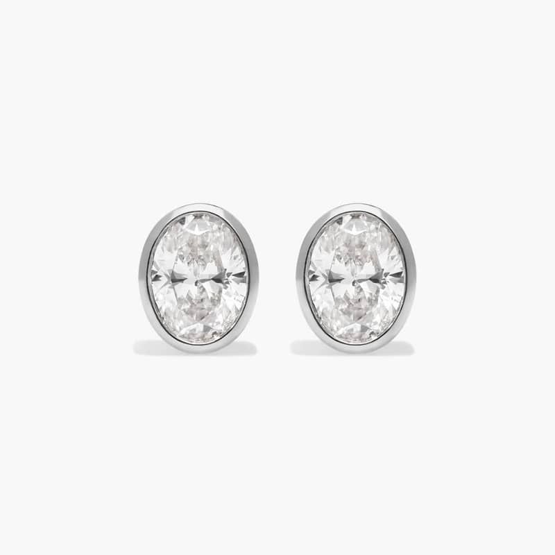 Bezel Diamond Stud Earrings With 0.5 CTW Oval Cut Diamonds in 14K White Gold