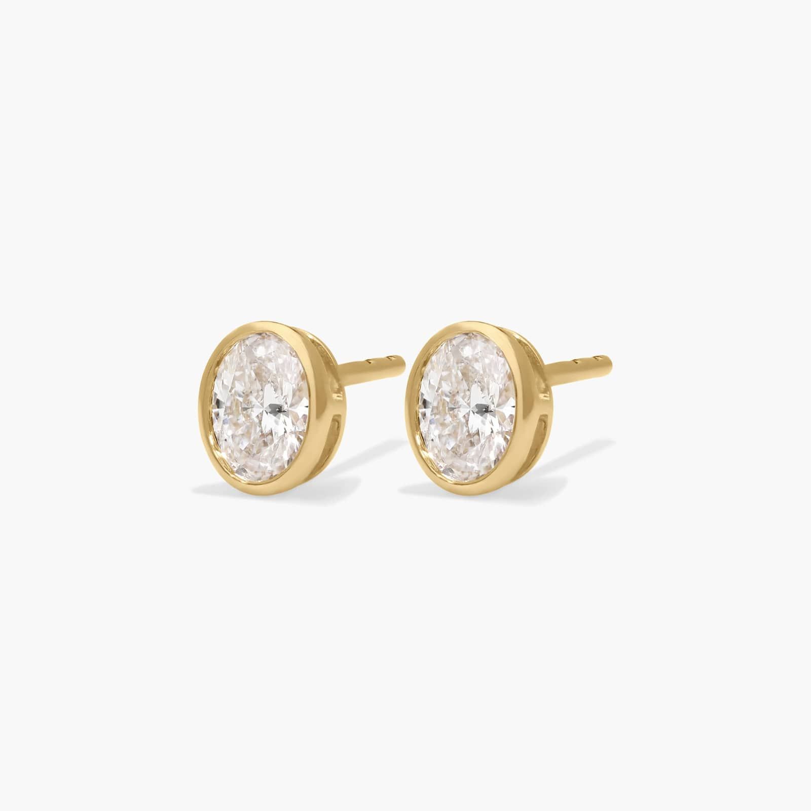 Bezel Stud Earrings With 0.5 CTW Oval Cut Lab-Grown Diamonds in 14K Yellow Gold
