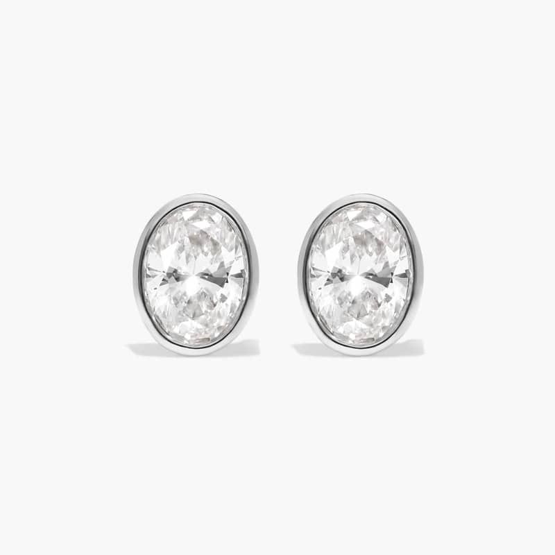 Bezel Diamond Stud Earrings With 0.75 CTW Oval Cut Diamonds in 14K White Gold