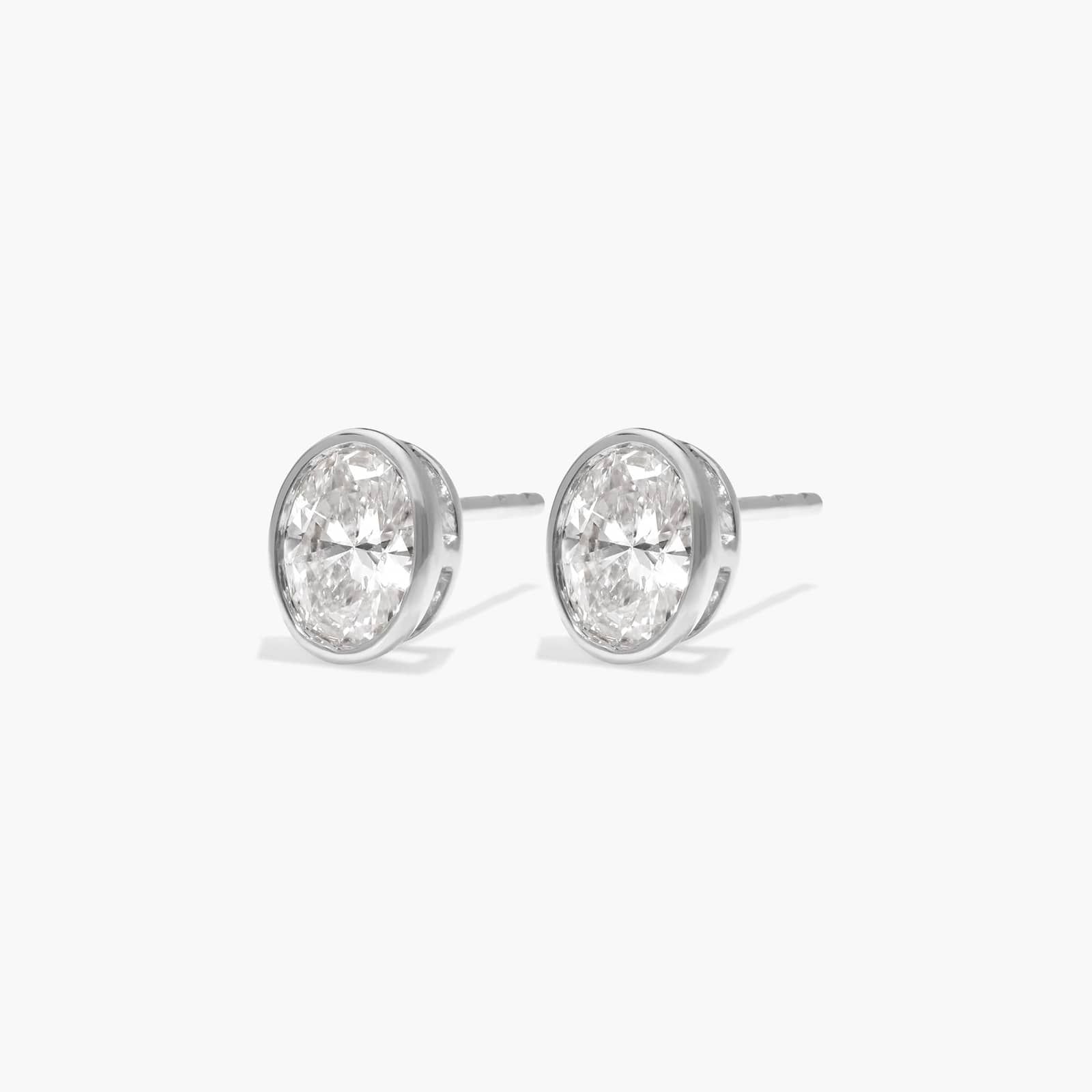 Bezel Stud Earrings With 0.75 CTW Oval Cut Lab-Grown Diamonds in 14K White Gold