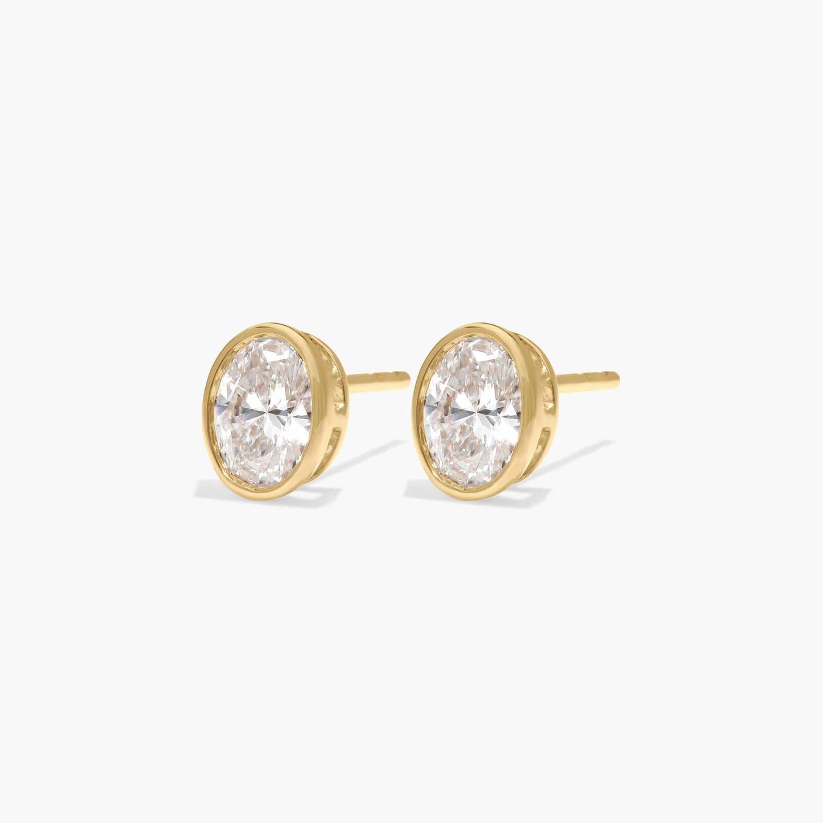 Bezel Stud Earrings With 0.75 CTW Oval Cut Lab-Grown Diamonds in 14K Yellow Gold