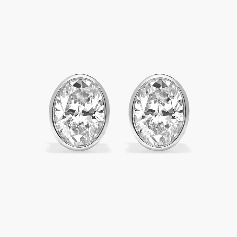 Bezel Diamond Stud Earrings With 1.5 CTW Oval Cut Diamonds in 14K White Gold