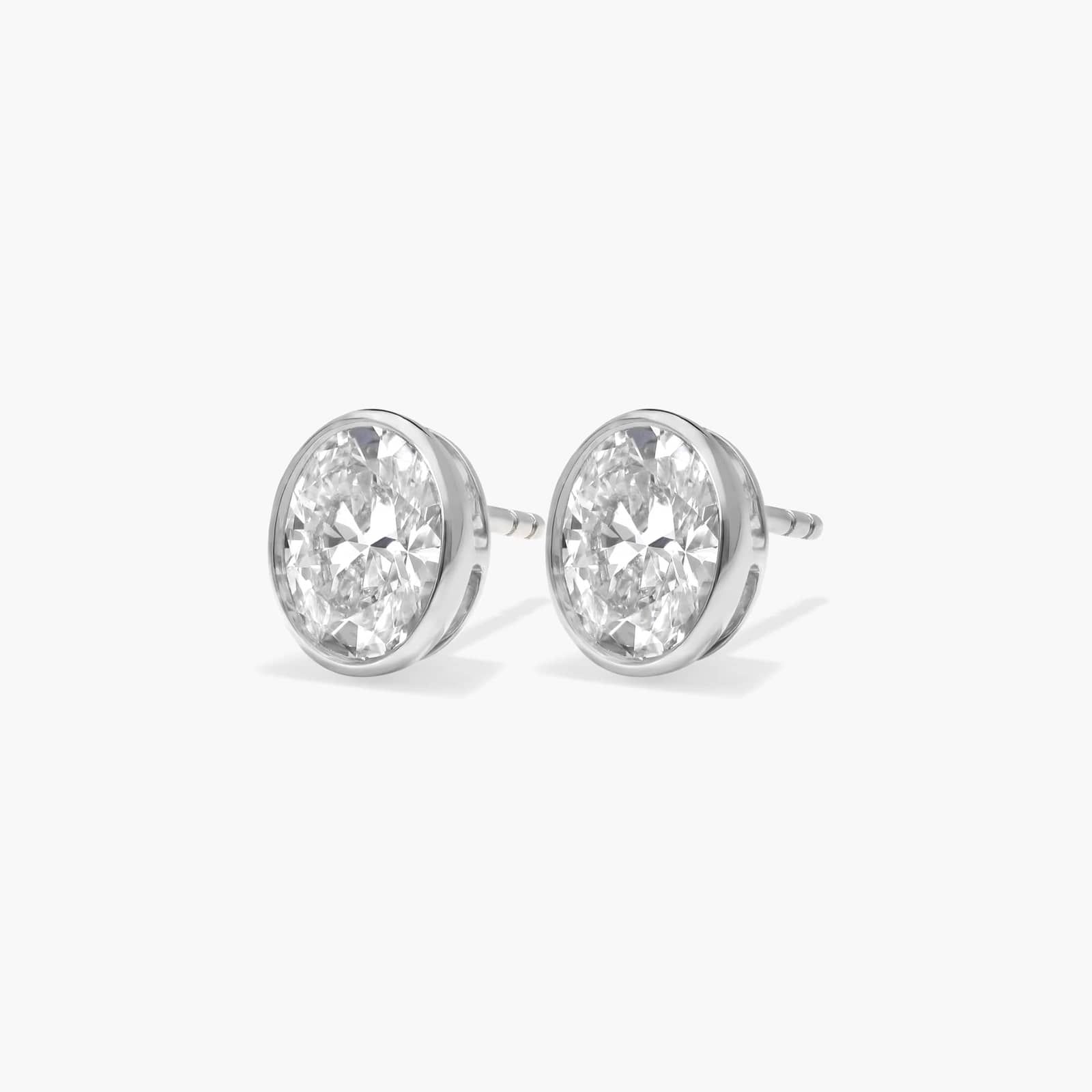 Bezel Stud Earrings With 1.5 CTW Oval Cut Lab-Grown Diamonds in 14K White Gold