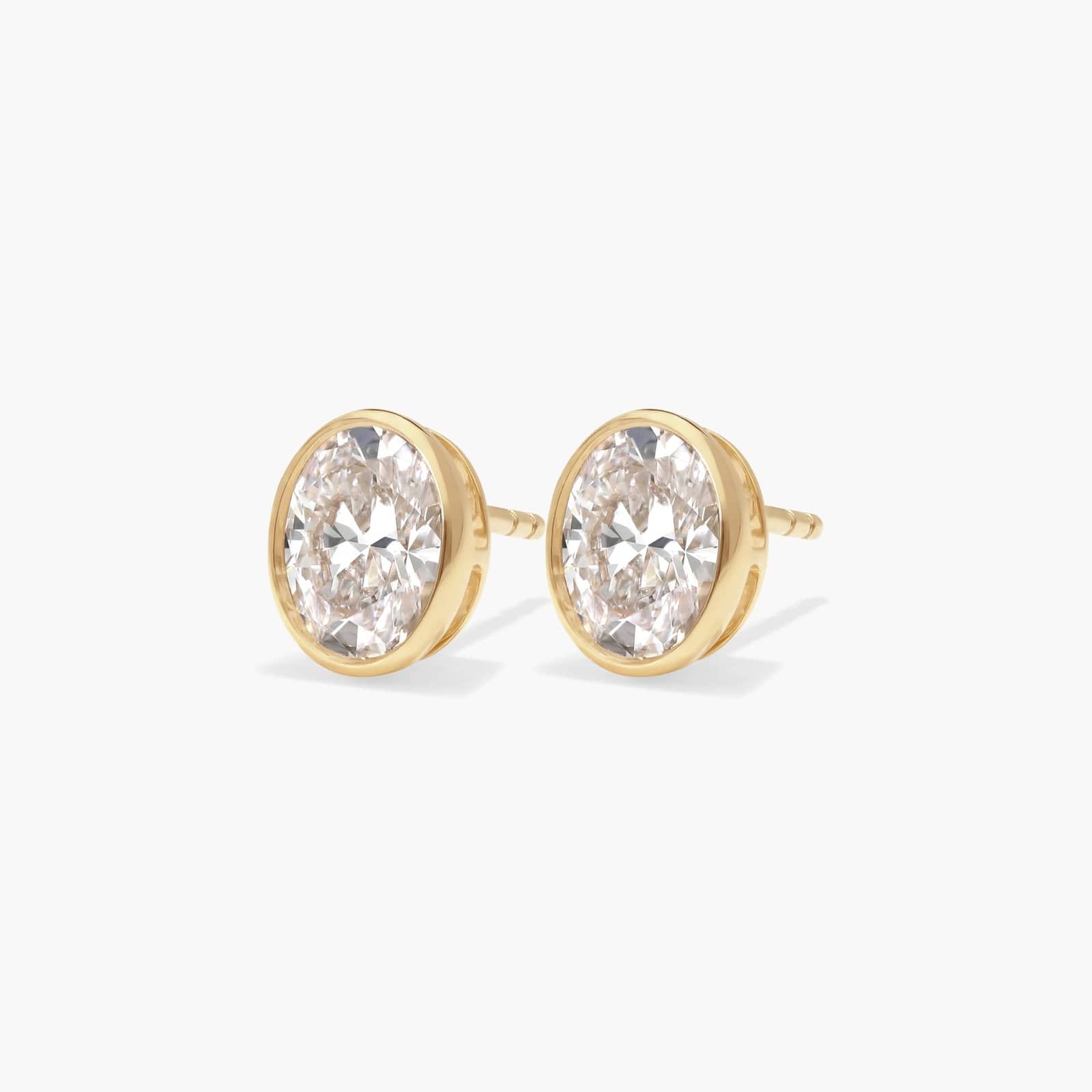 Bezel Stud Earrings With 1.5 CTW Oval Cut Lab-Grown Diamonds in 14K Yellow Gold