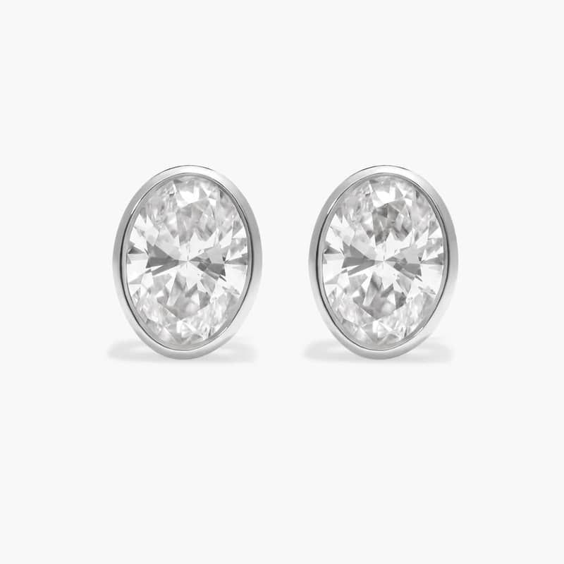 Bezel Diamond Stud Earrings With 2 CTW Oval Cut Diamonds in 14K White Gold