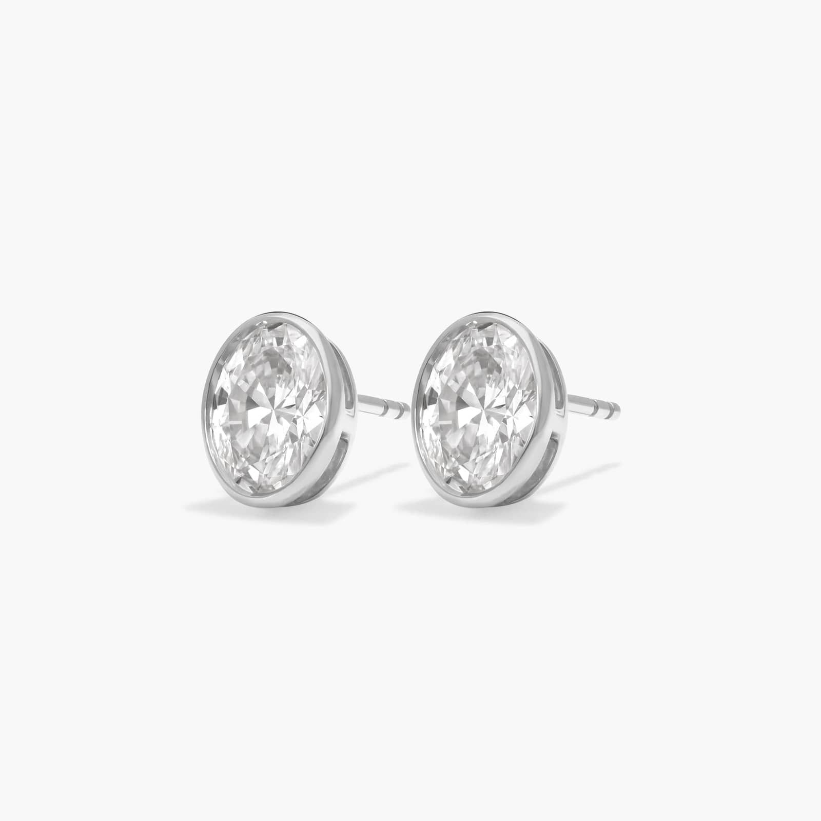 Bezel Stud Earrings With 2 CTW Oval Cut Lab-Grown Diamonds in 14K White Gold