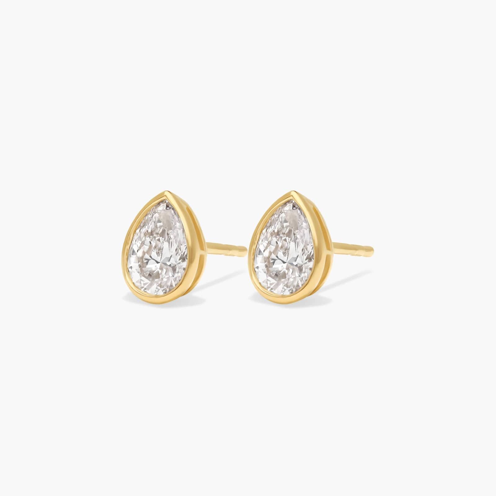 Bezel Diamond Stud Earrings With 0.75 CTW Pear Shaped Diamonds in 14K Yellow Gold