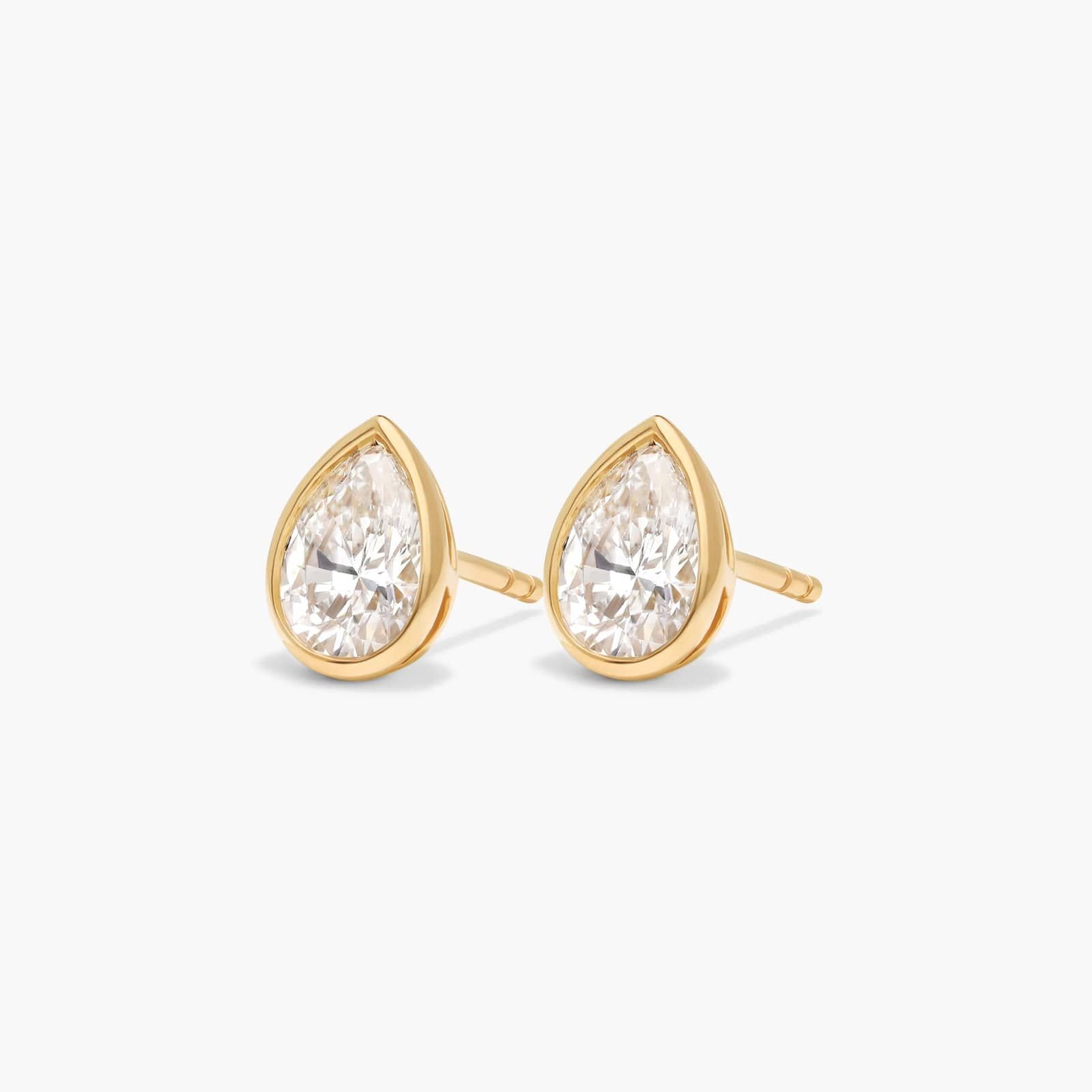 Bezel Diamond Stud Earrings With 1 CTW Pear Shaped Diamonds in 14K Yellow Gold
