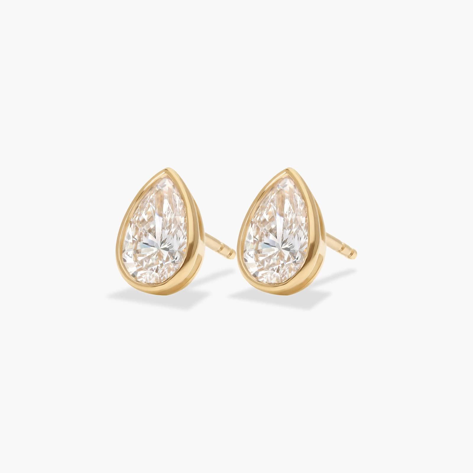 Bezel Diamond Stud Earrings With 1.5 CTW Pear Shaped Diamonds in 14K Yellow Gold